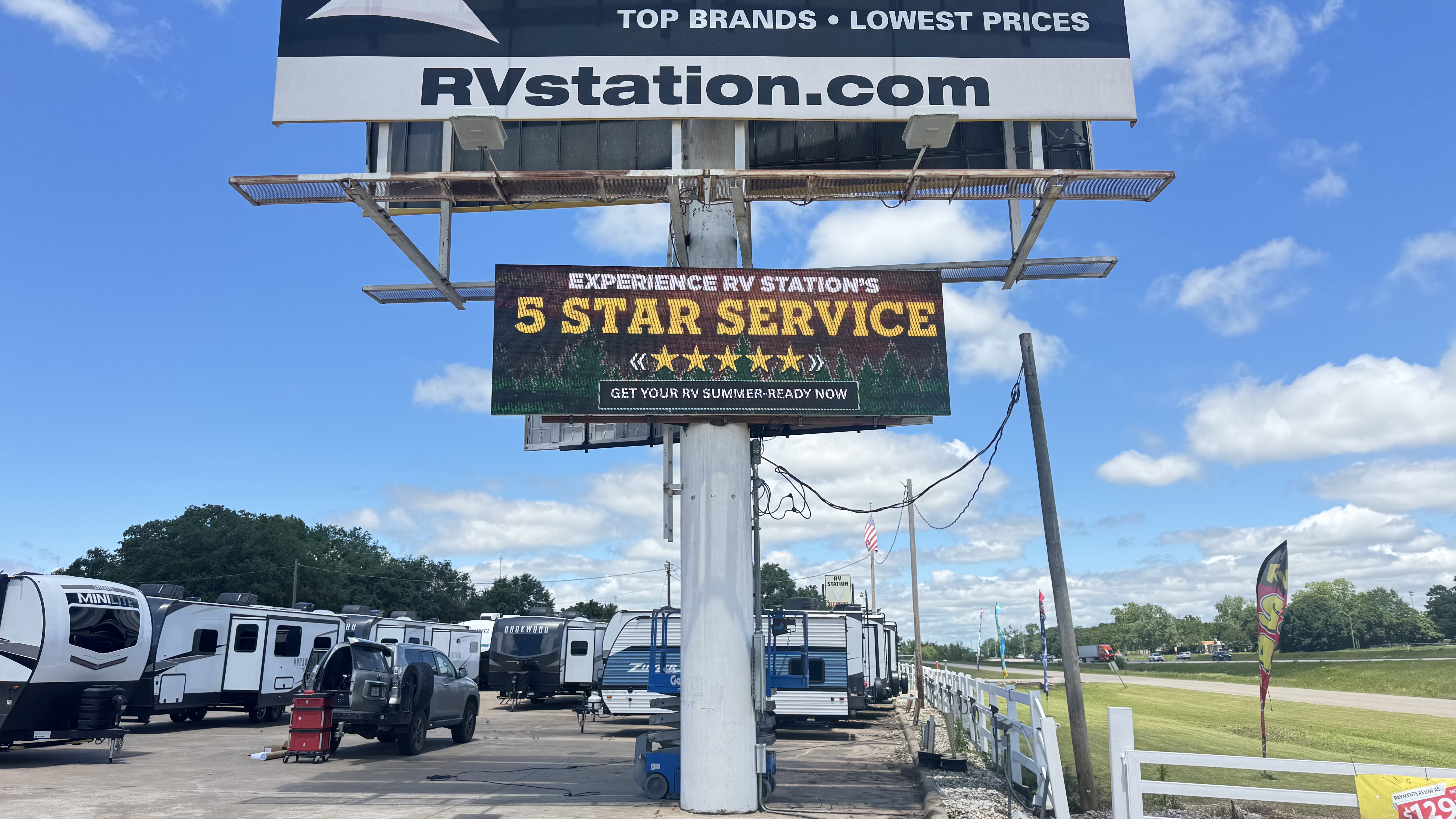 2.	Wide view of the new highway-facing LED sign above the RV Station lot near Lake Texoma—1-for-1 replacement using the existing frame.
