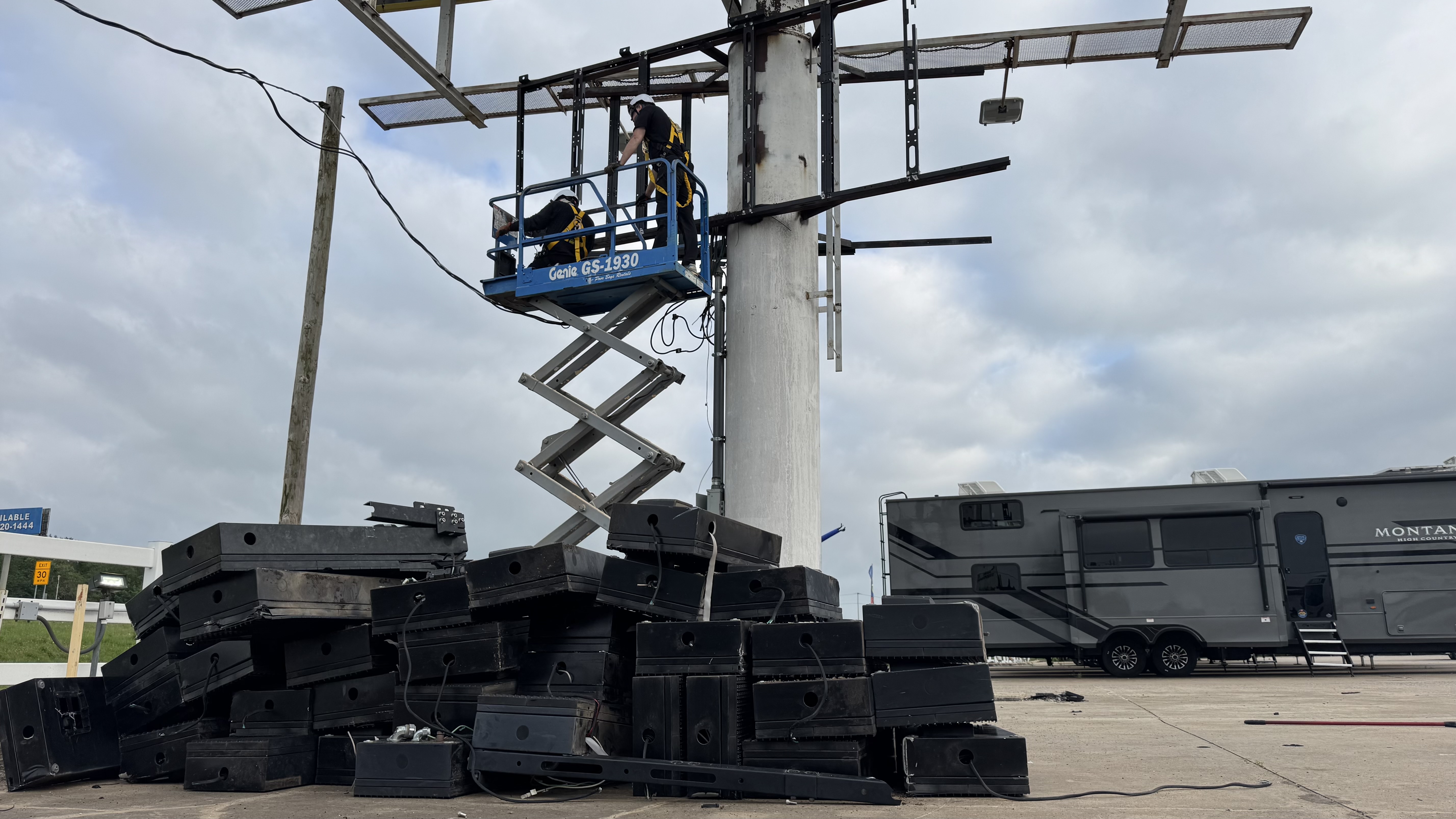5.	Teardown phase: old digital sign components removed as technicians prepare the existing frame for the new double-sided LED screen.