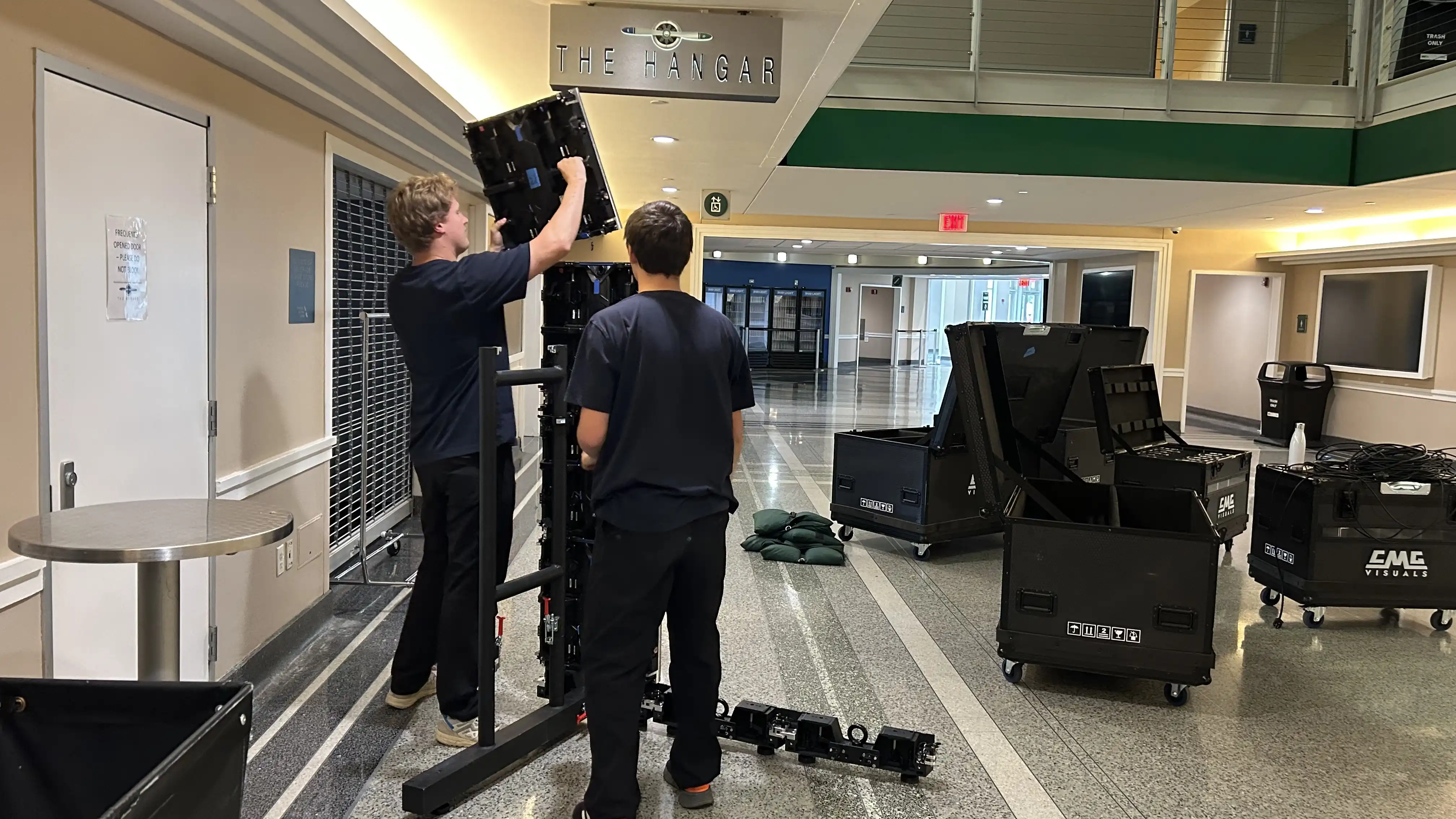 CMG Visuals team installing 101R Series P2.6mm LED panels for digital signage deployment at American Airlines Center in Dallas.