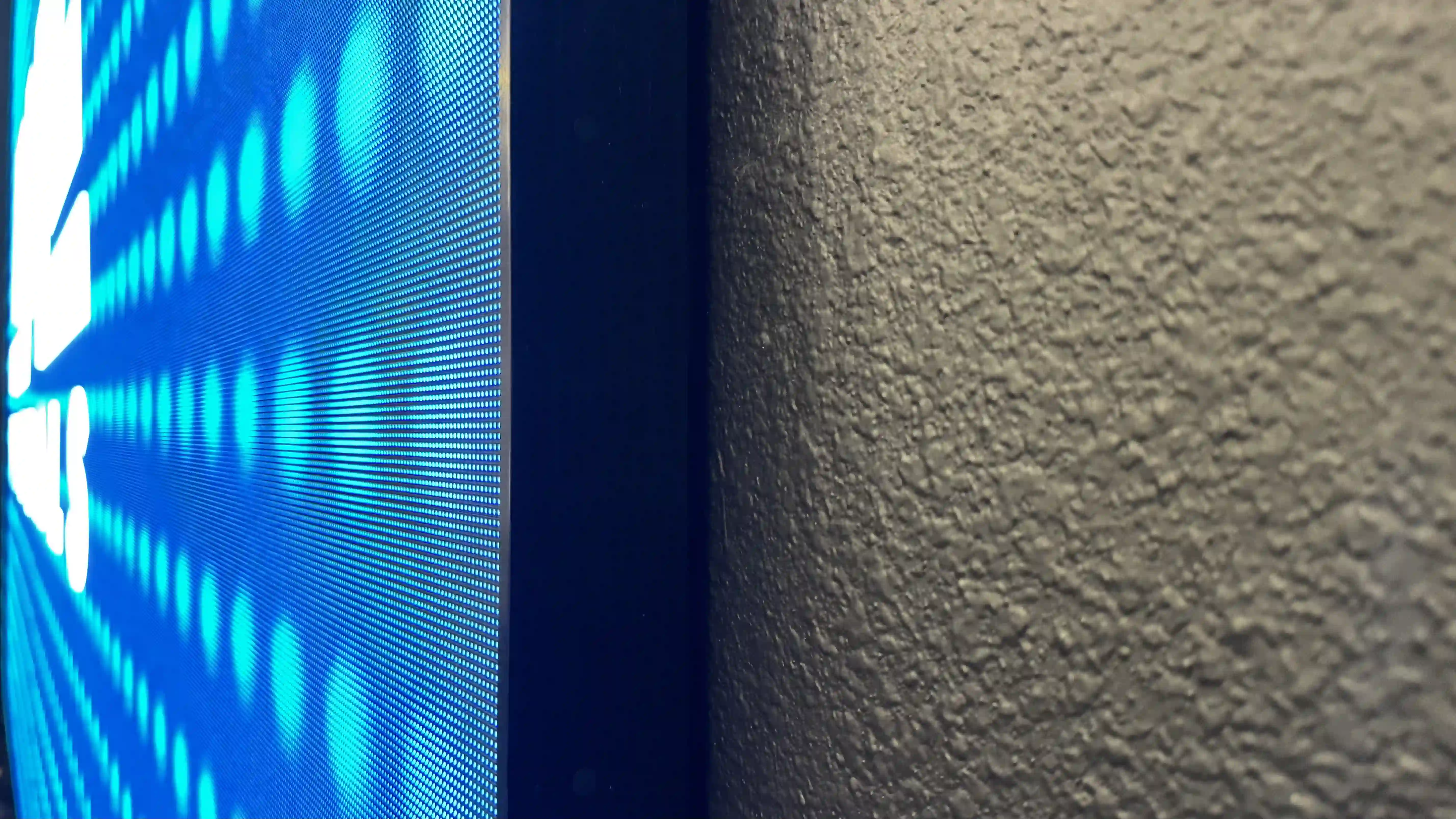 Close-up side profile showing flush, tight-tolerance LED display trim against wall at Keystone Church Mesquite, Texas.