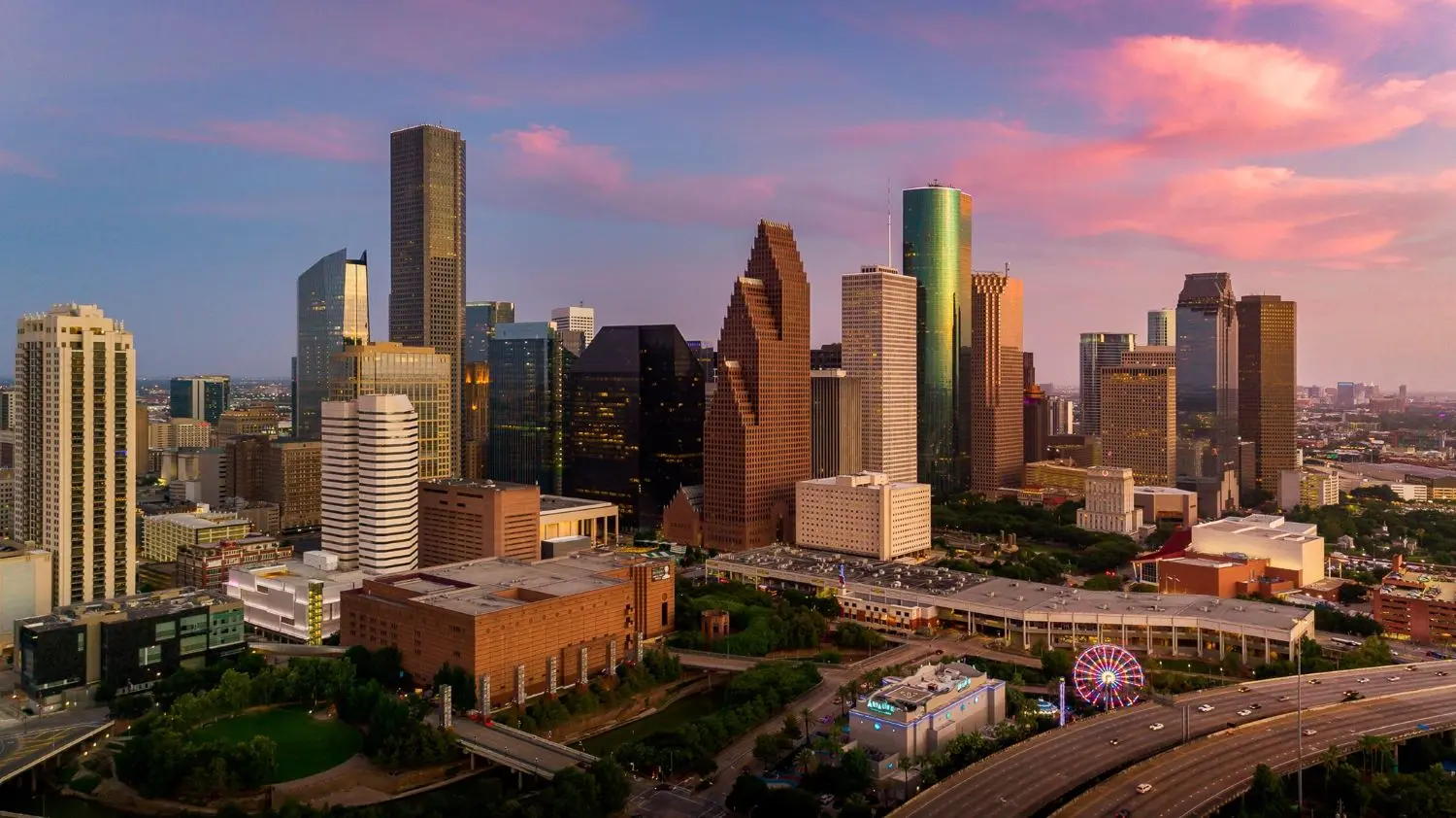 Houston Texas skyline at sunset with downtown skyscrapers, representing LED video wall services in Houston TX