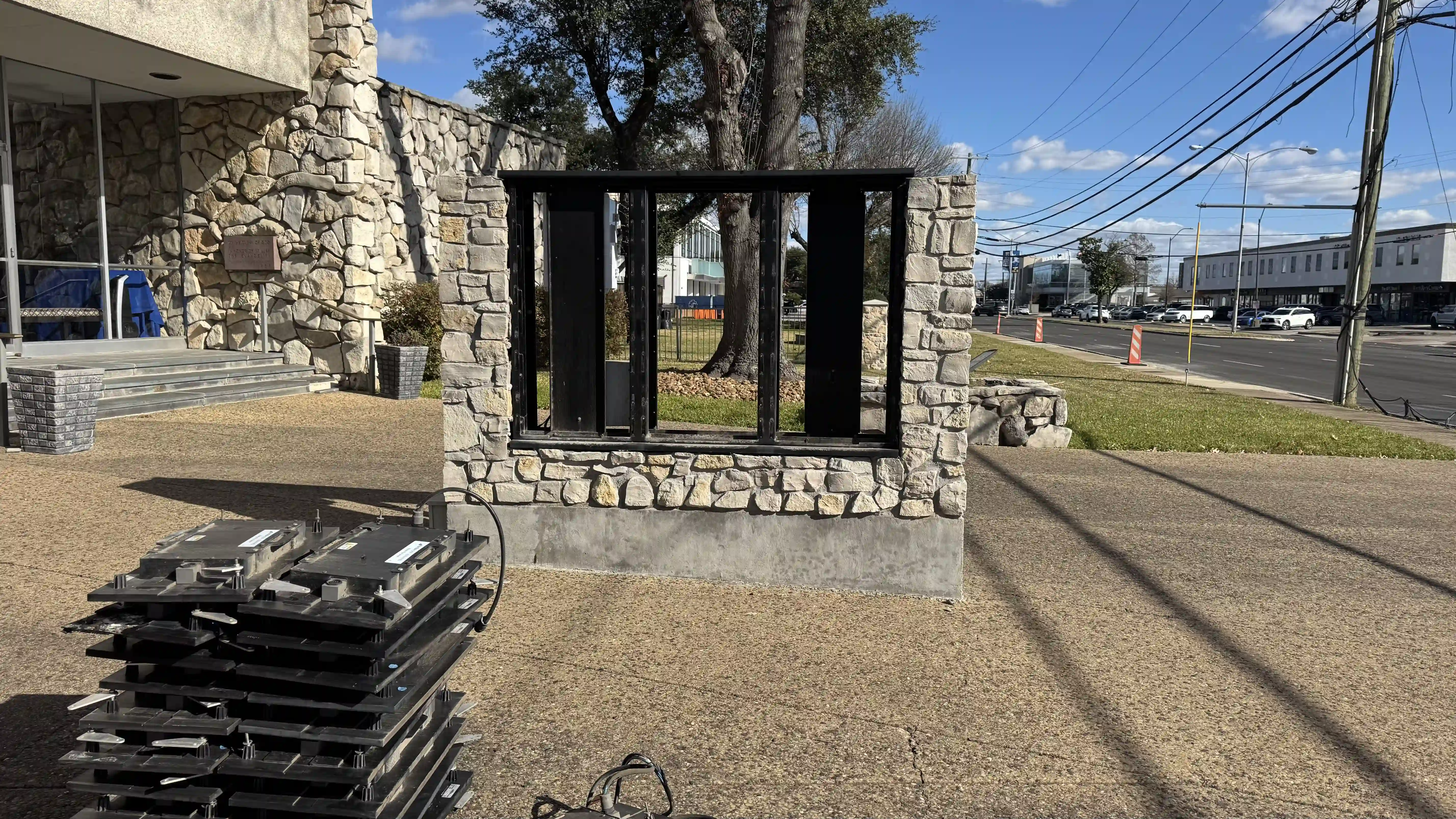 Technicians removing outdated LED panels from old church sign structure during replacement project in North Dallas