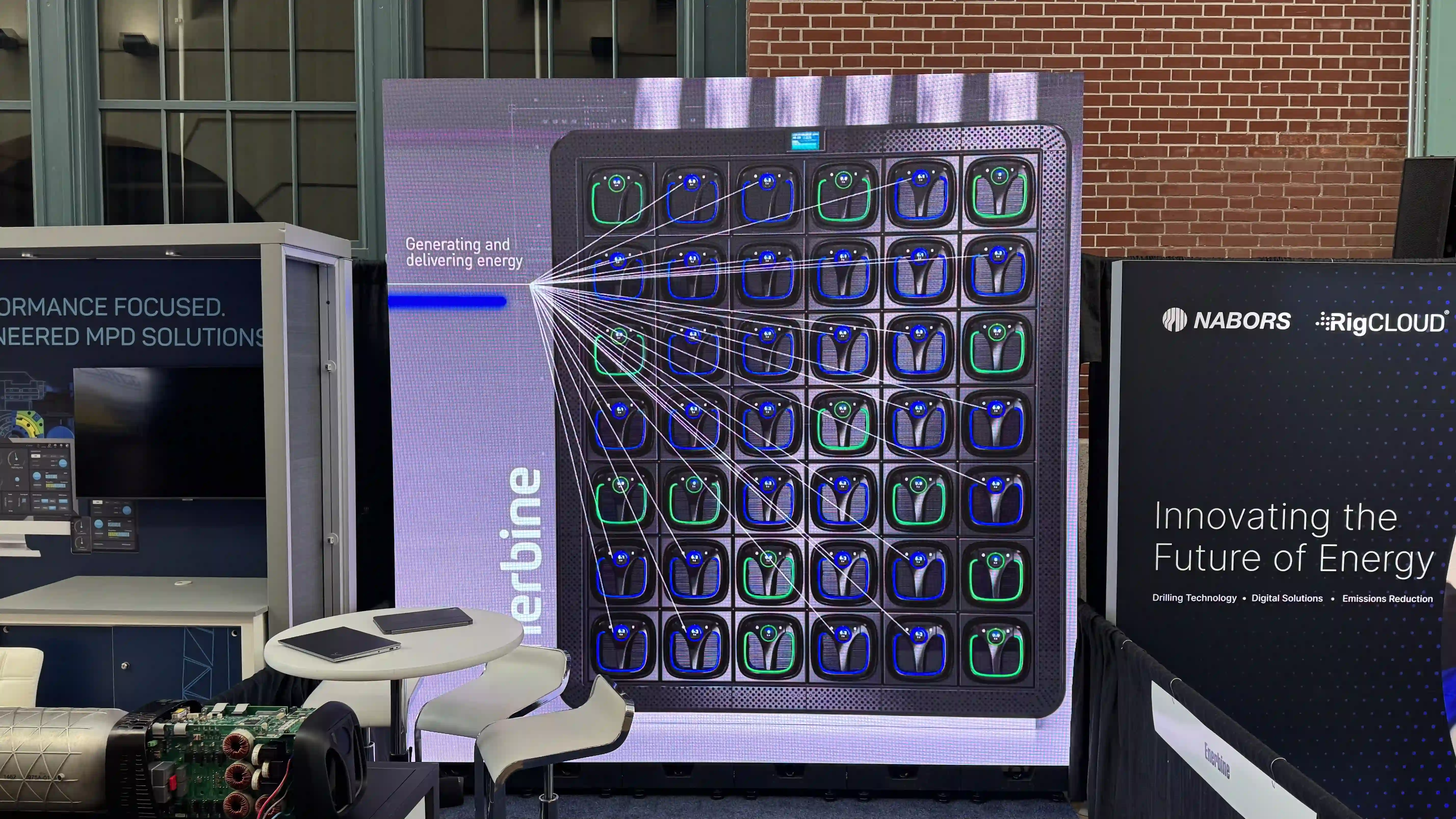 Enerbine booth with 10x10 LED video wall displaying energy visuals at Thrive 2026 Houston trade show