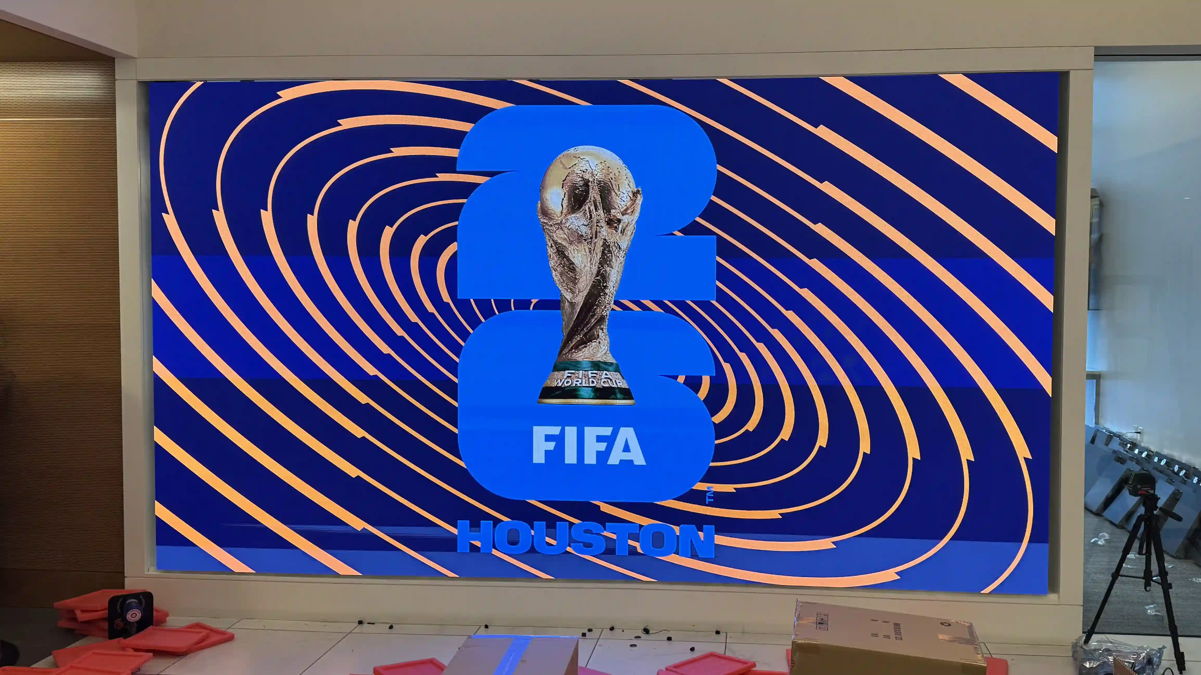Large indoor LED video wall display in Houston TX showing FIFA World Cup content during installation for the Harris County Sports Authority