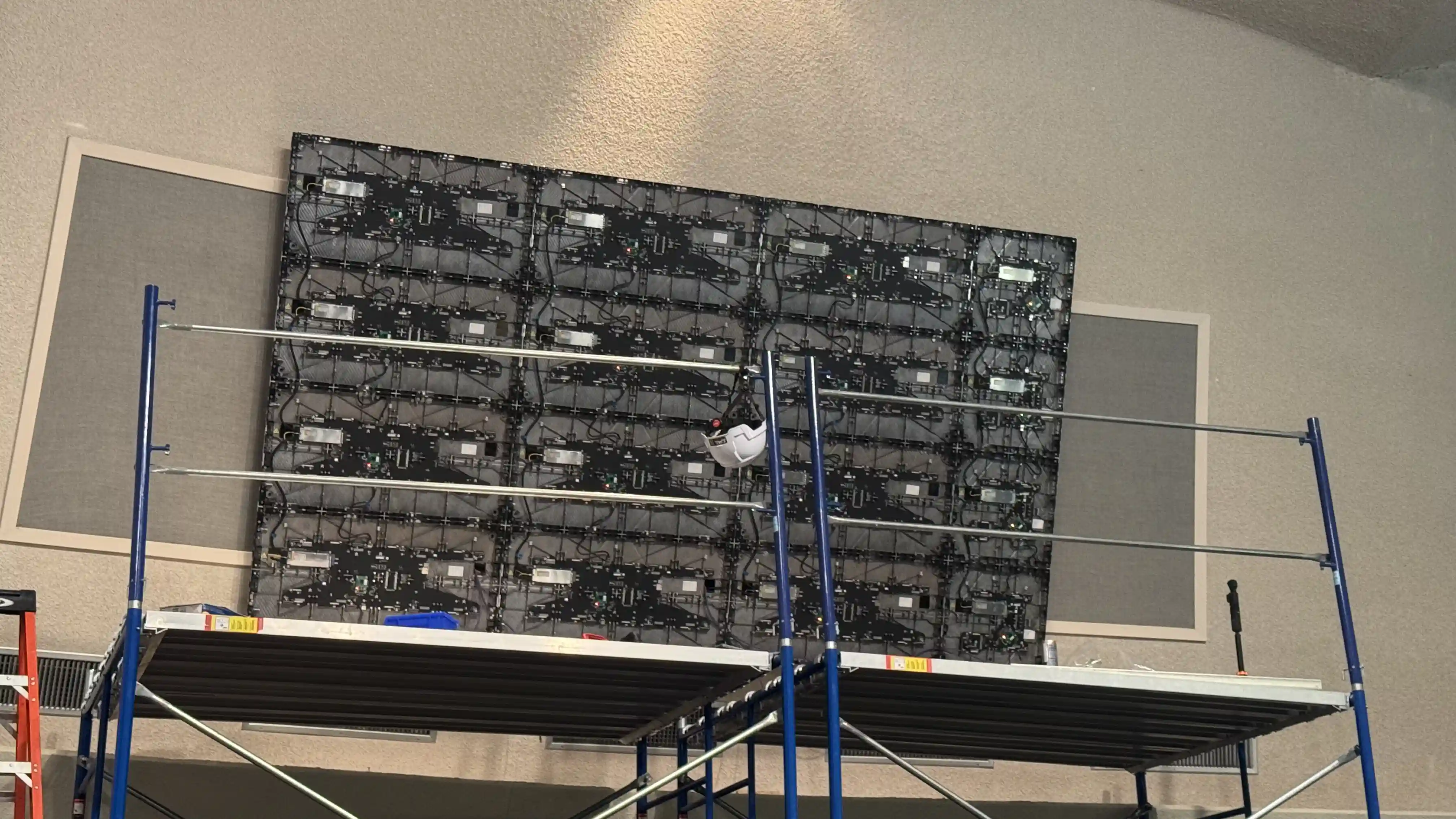 Large indoor LED video wall installation in Austin Texas using scaffolding and panel grid