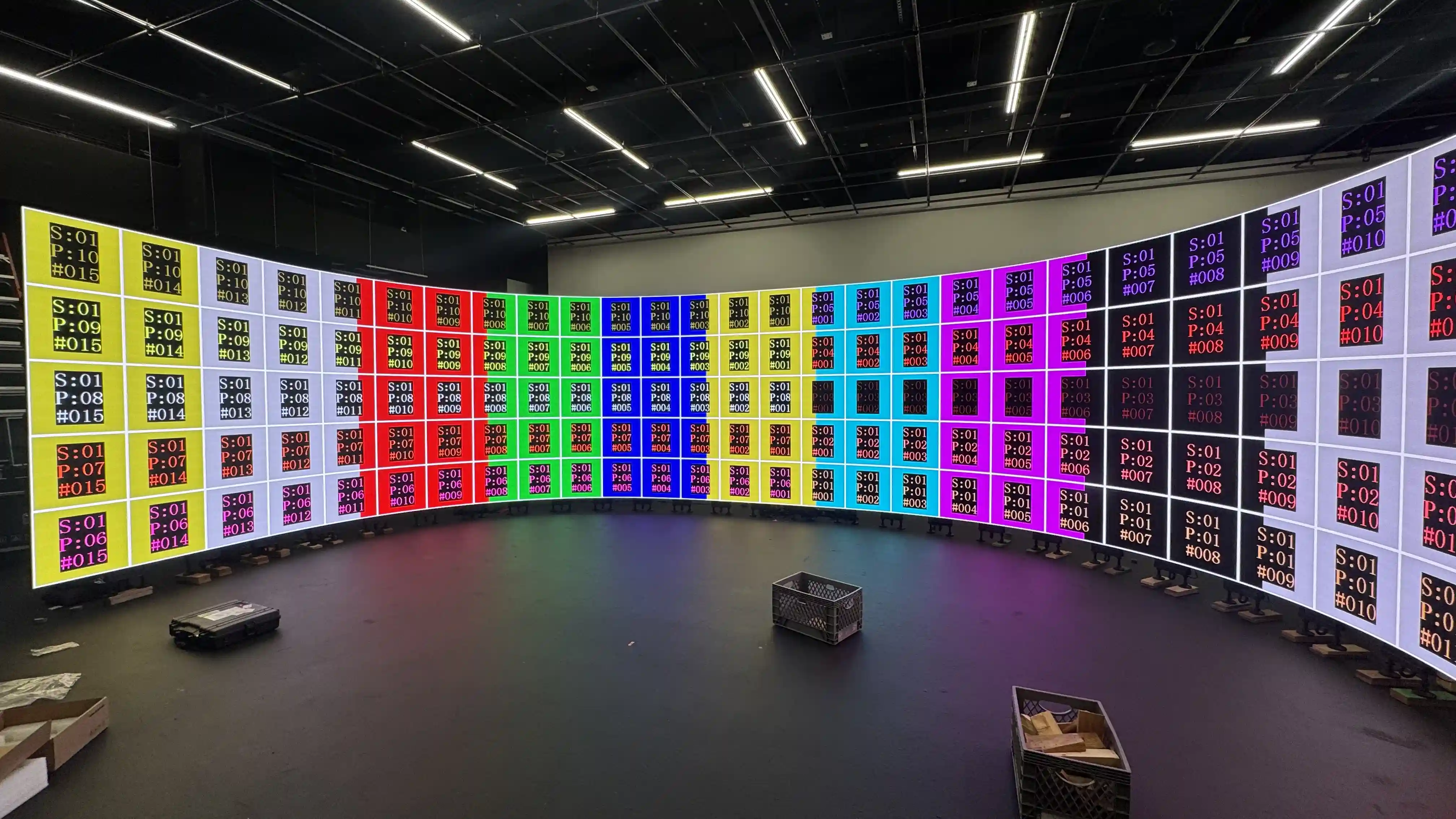 Curved LED video wall displaying calibration test pattern for large-scale installation