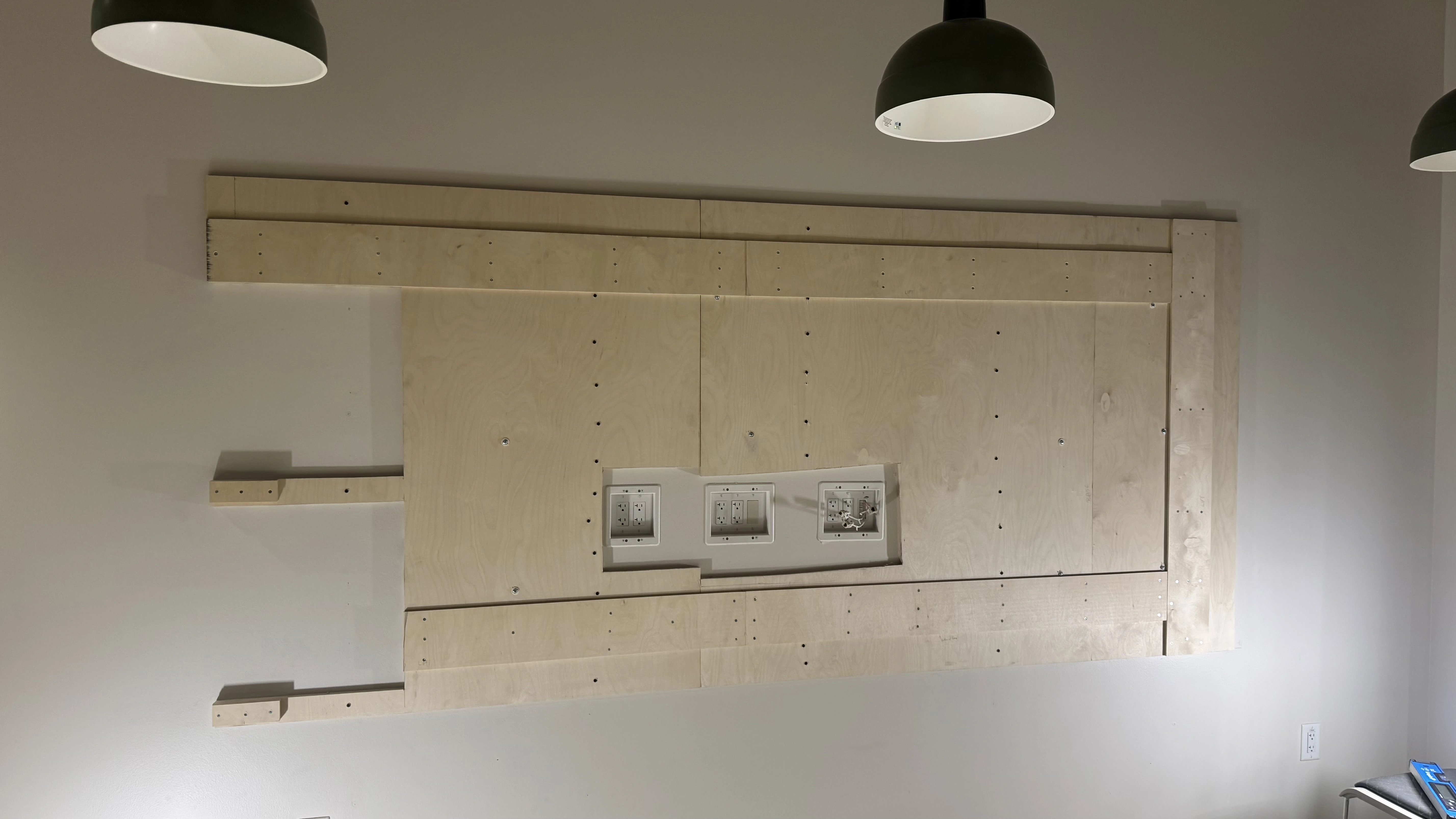 Plywood mounting backing and electrical prep for LED video wall at Compass Datacenters