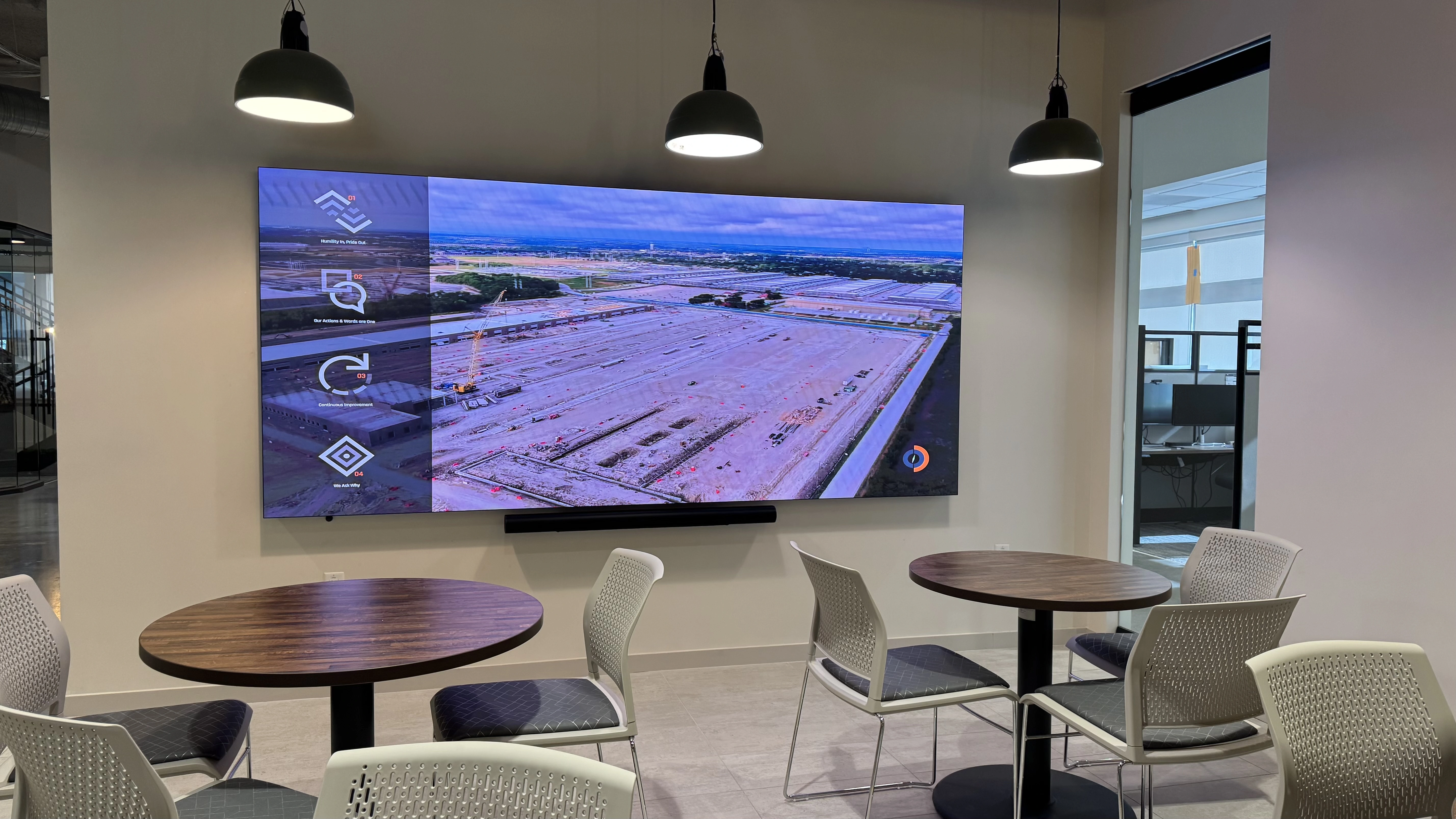 Finished LED video wall displaying Compass Datacenters branding in a corporate office space