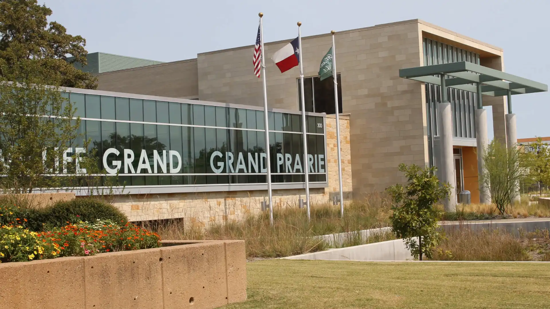 Grand Prairie, Texas city building with flags and Grand Prairie signage