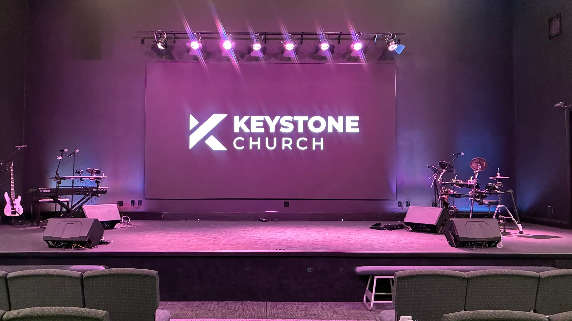 LED stage screen showing Church logo