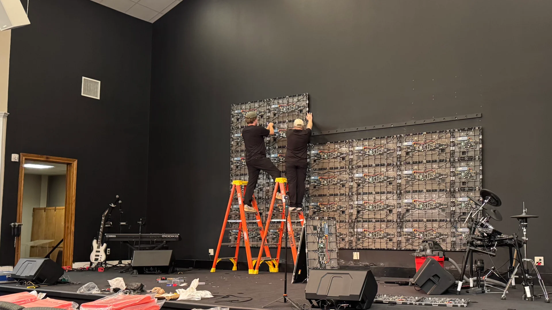 Technicians installing LED video wall