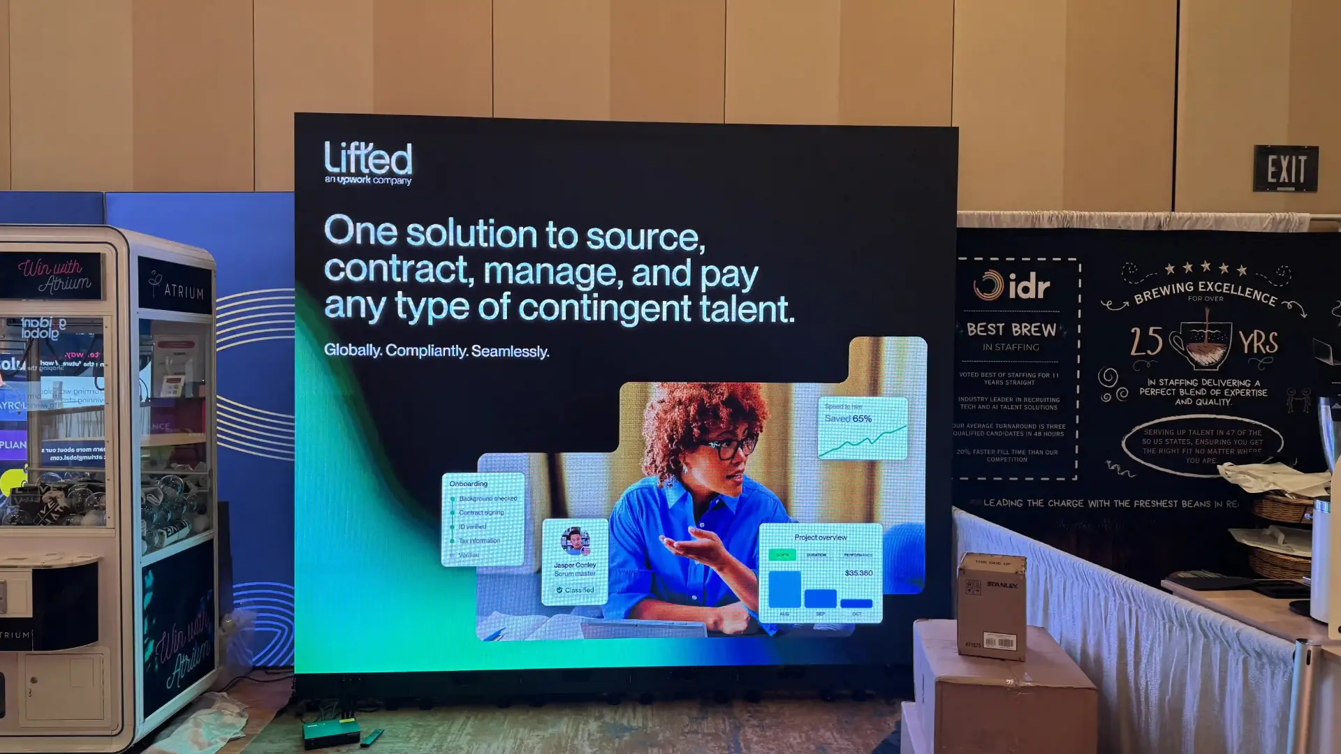 LED video wall displaying Lifted by Upwork ad