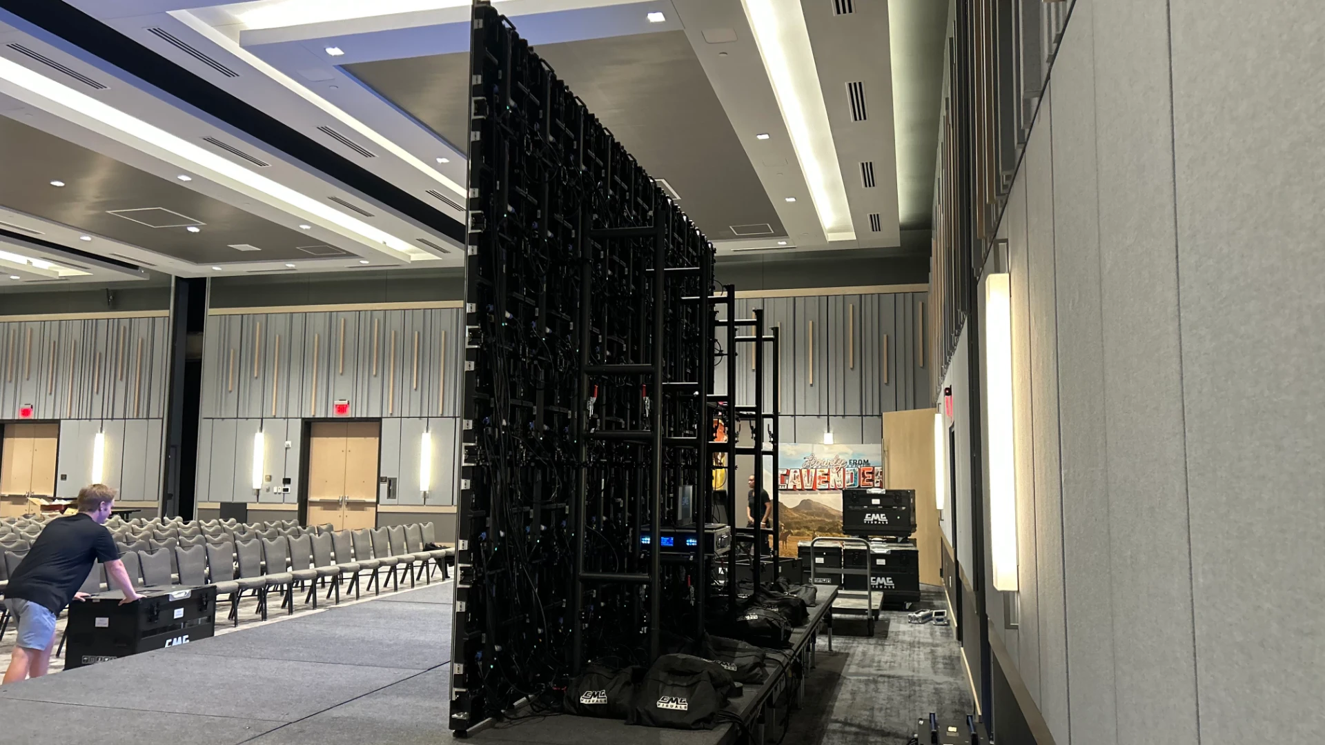 CMG Visuals crew setting up rental LED wall at event