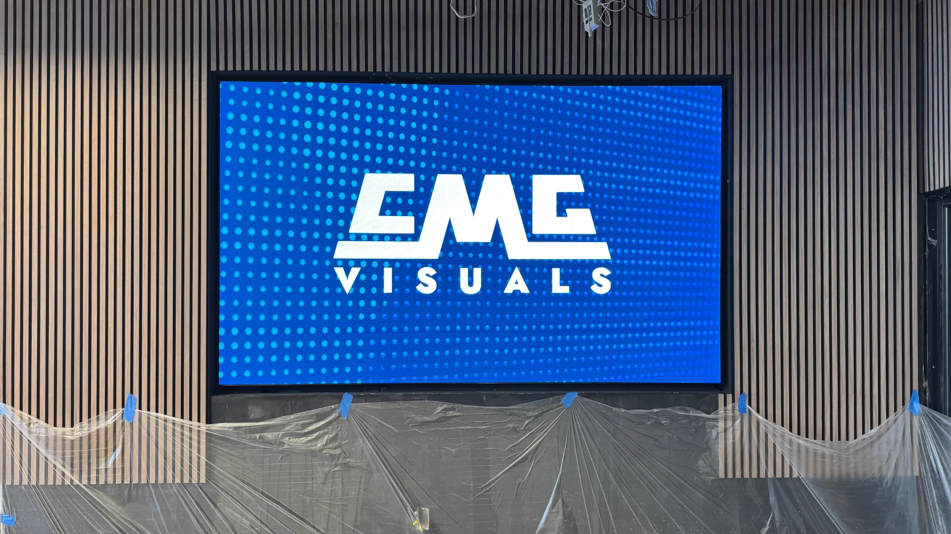 ndoor LED screen displaying CMG Visuals logo at Bodega Fine Spirits