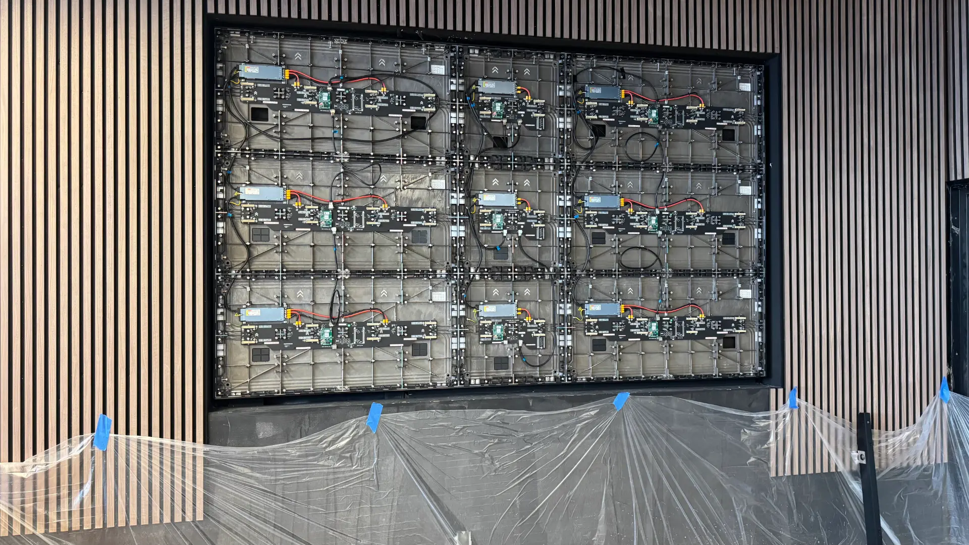Back of LED screen panels mid-installation at Bodega Fine Spirits