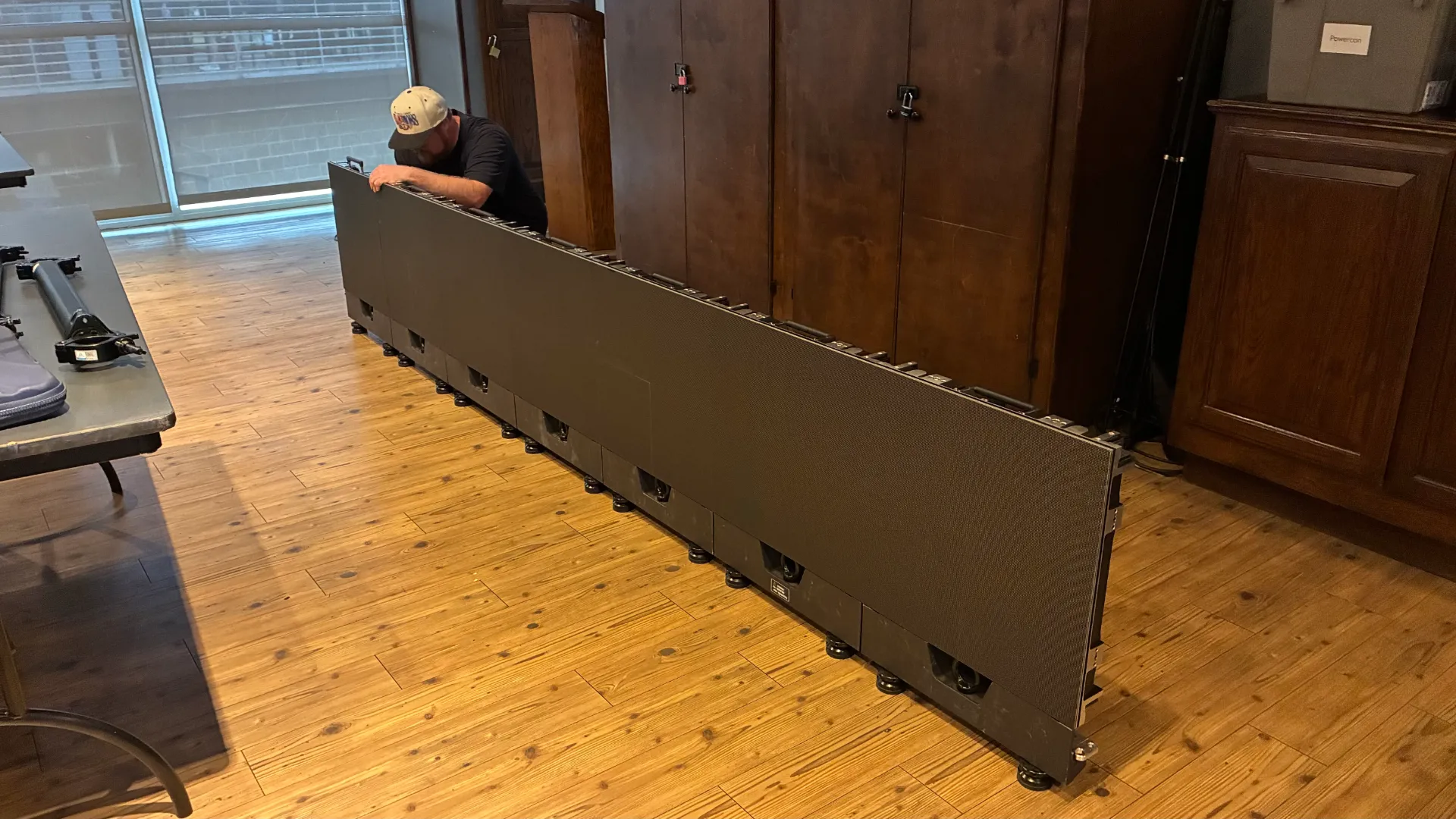 CMG Visuals technician assembling rental LED wall at Topgolf