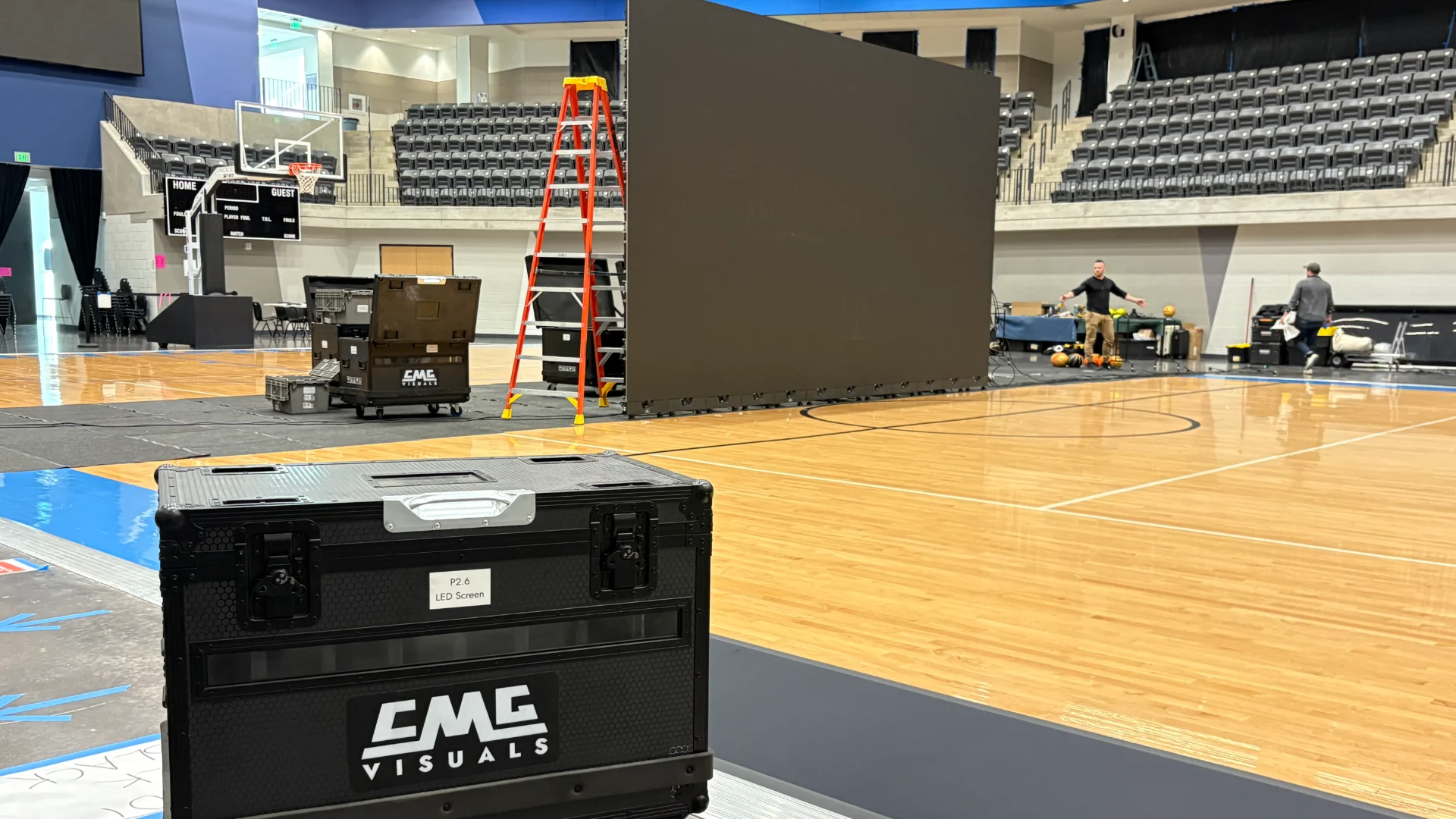 CMG Visuals flight case labeled "P2.6 LED Screen" beside the LED video wall built for the BetMGM production.
