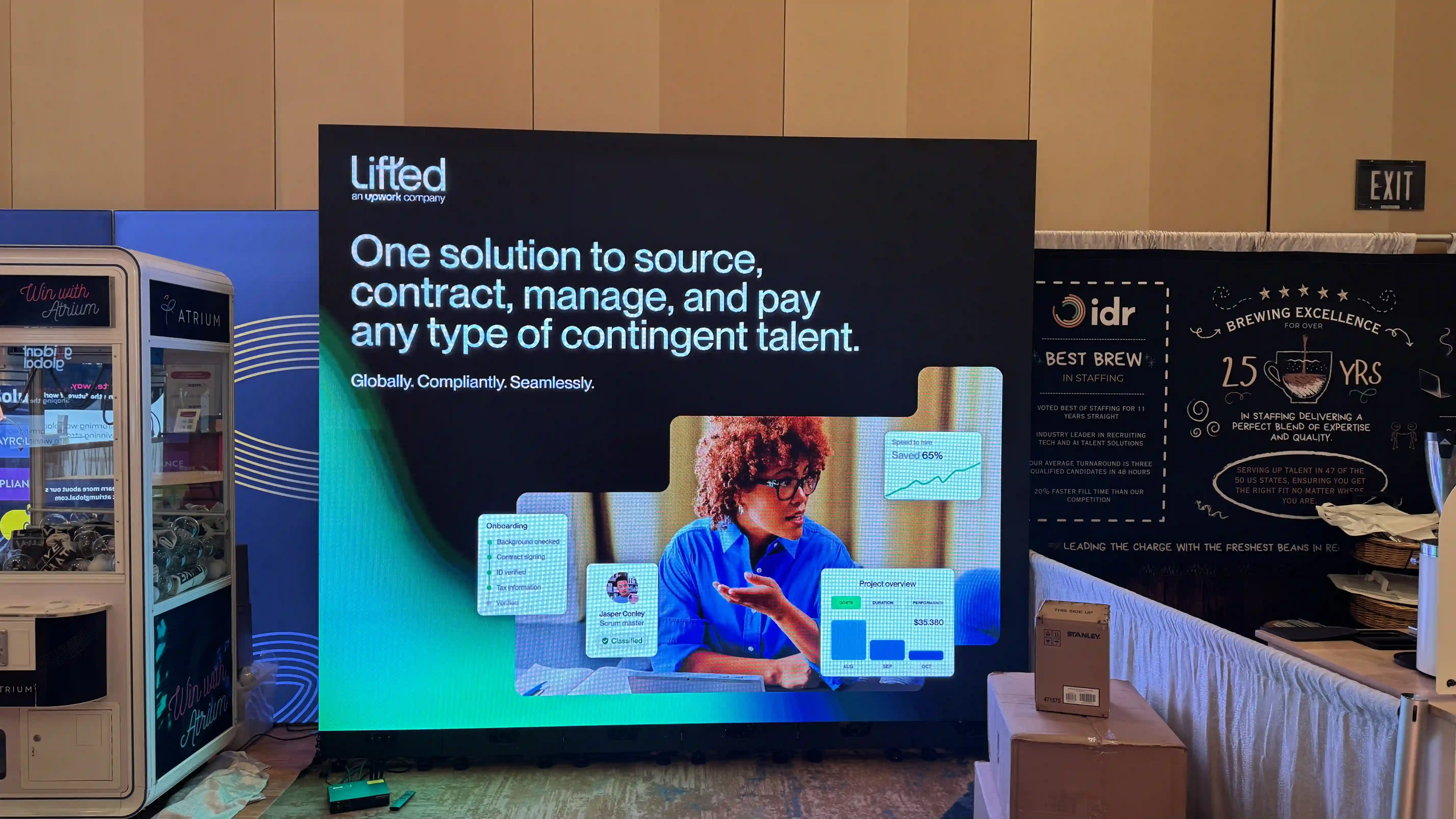 CMG Visuals indoor LED wall lit up at the Lifted, an Upwork Company trade show booth at a staffing industry expo. 