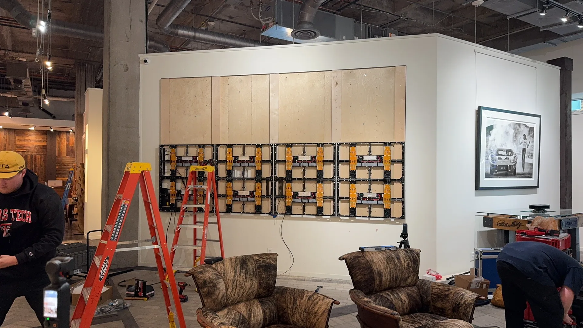 CMG Visuals technicians installing the LED wall panel by panel in David Yarrow's Fort Worth gallery.