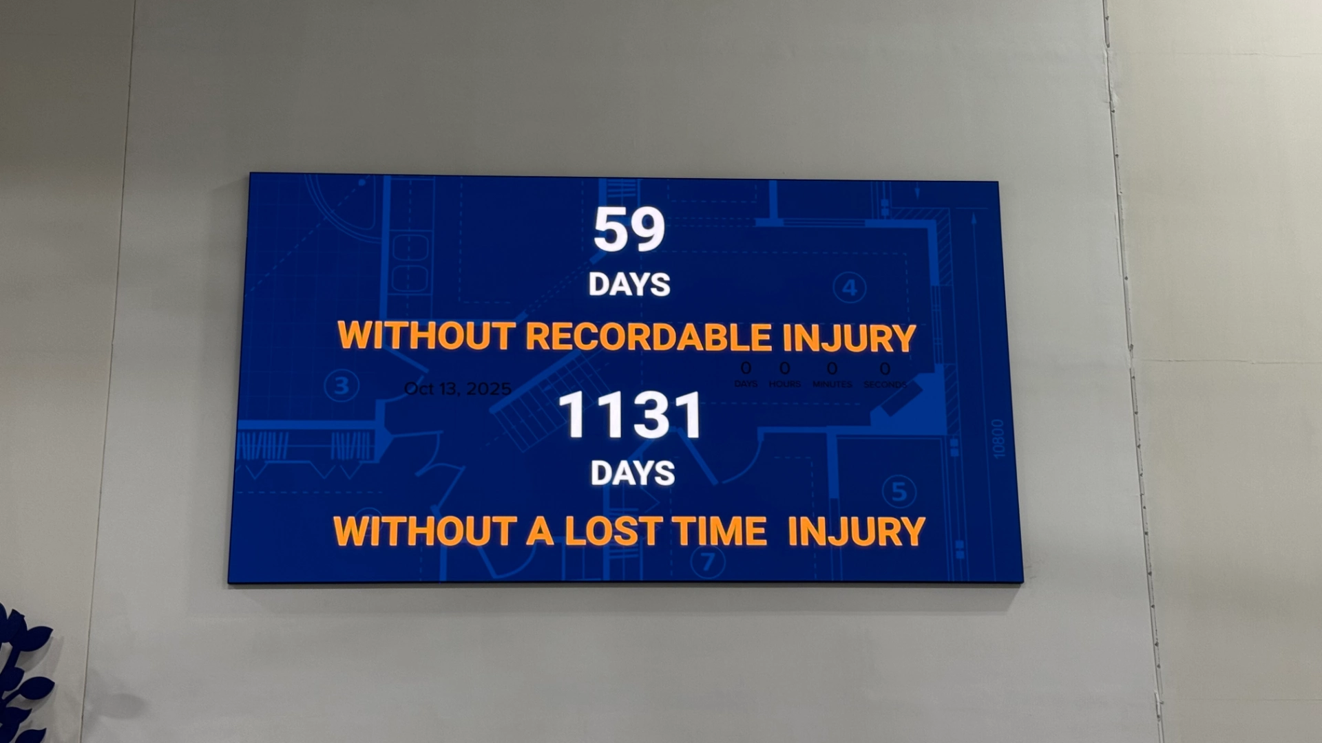 CMG Visuals indoor LED display showing workplace safety day counters in the Smith System employee break area.