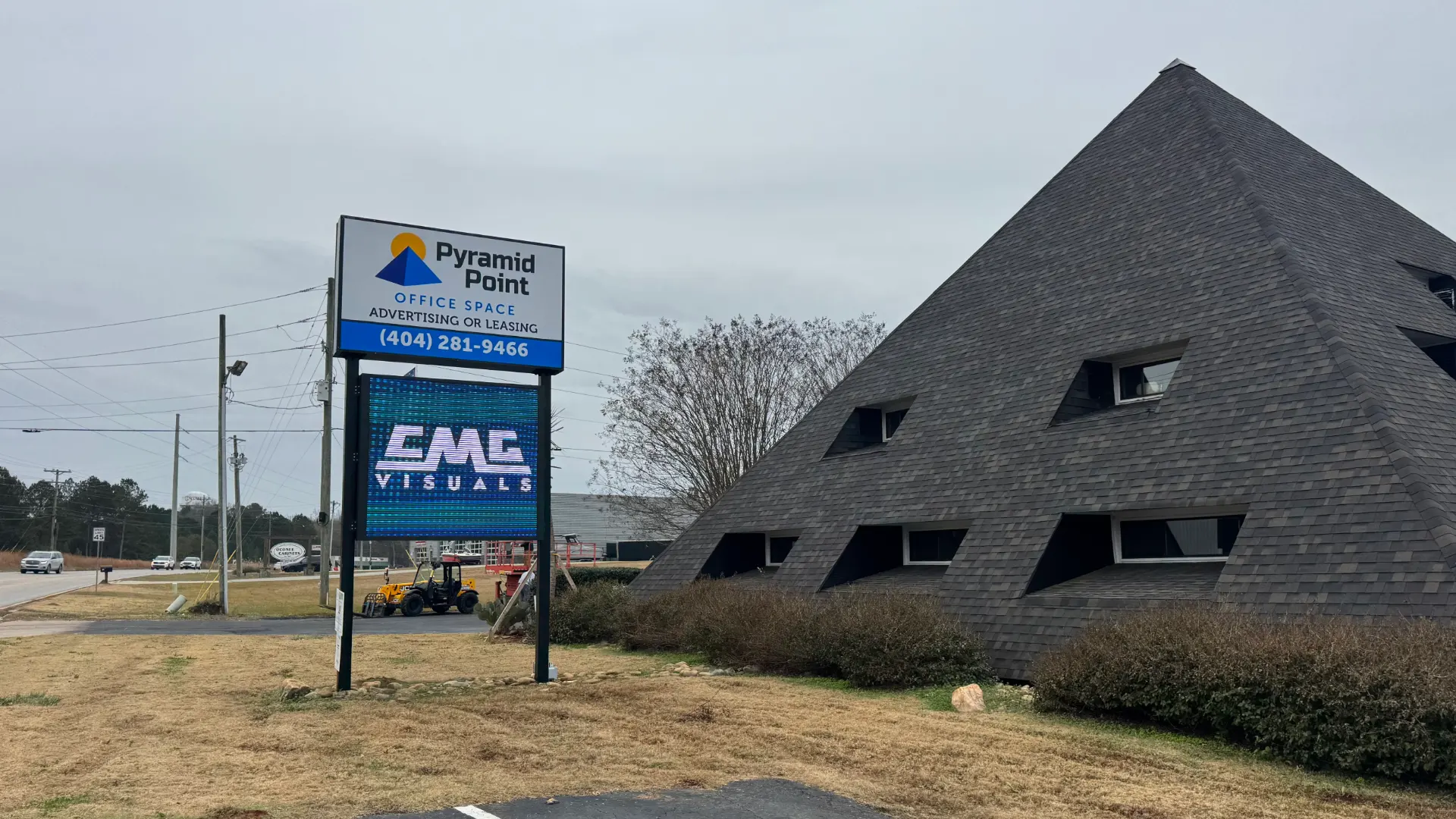 CMG Visuals outdoor LED pylon sign lit up roadside at Pyramid Point in Greensboro.