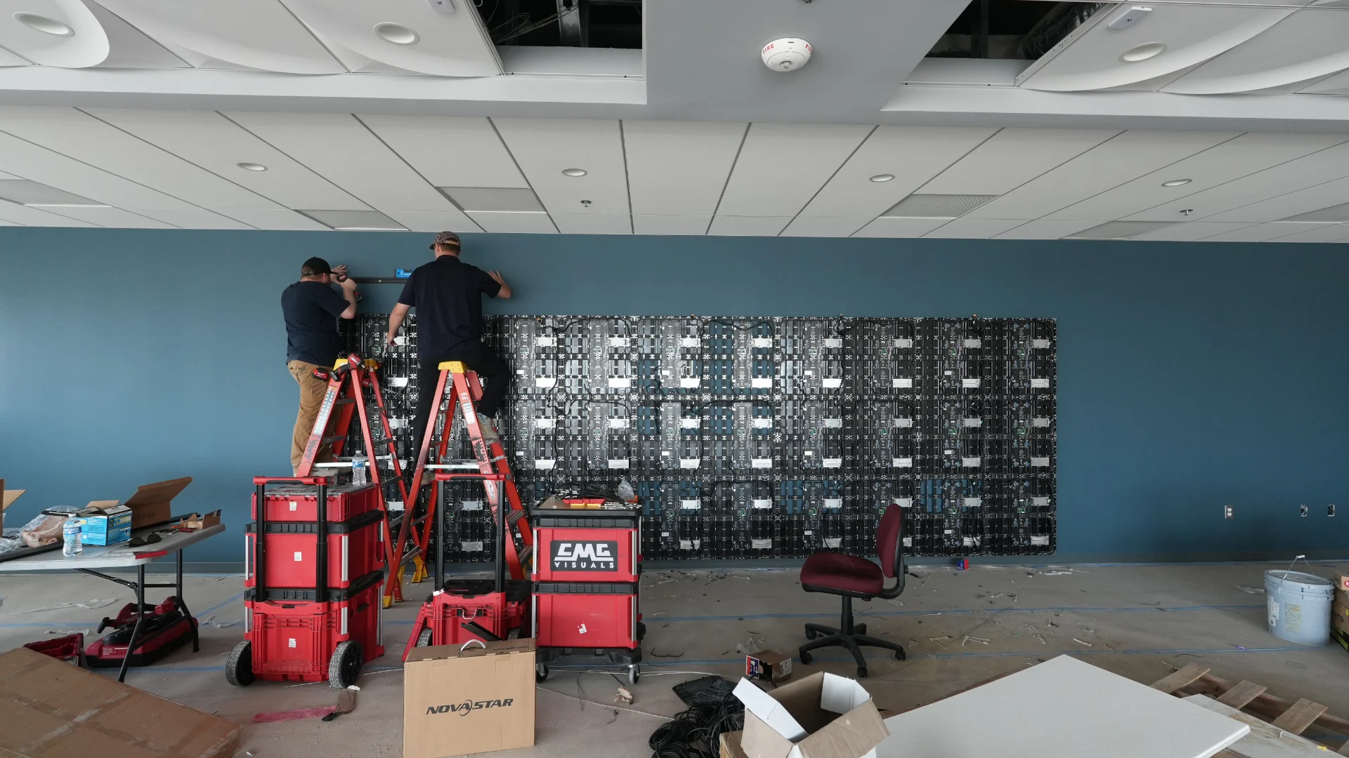 CMG Visuals technicians installing the indoor LED wall at Education Service.