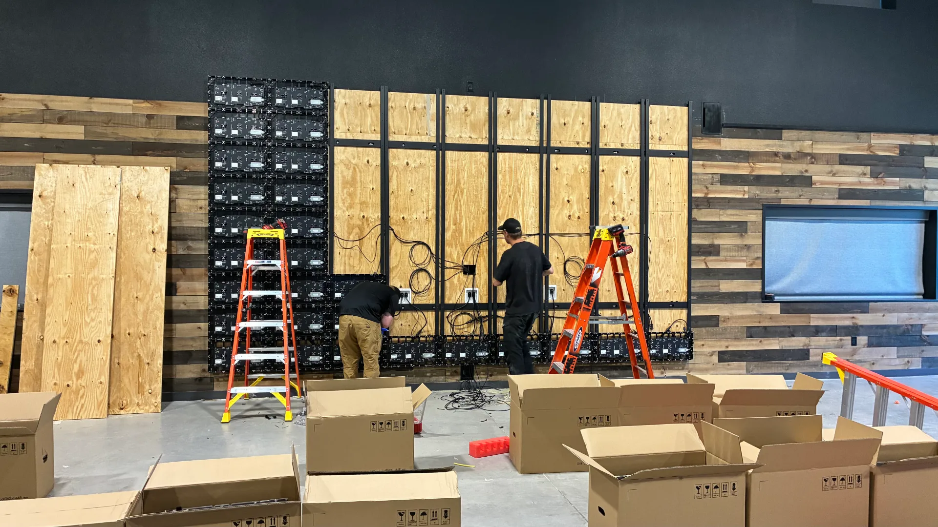 CMG Visuals technicians installing the indoor LED wall panel by panel