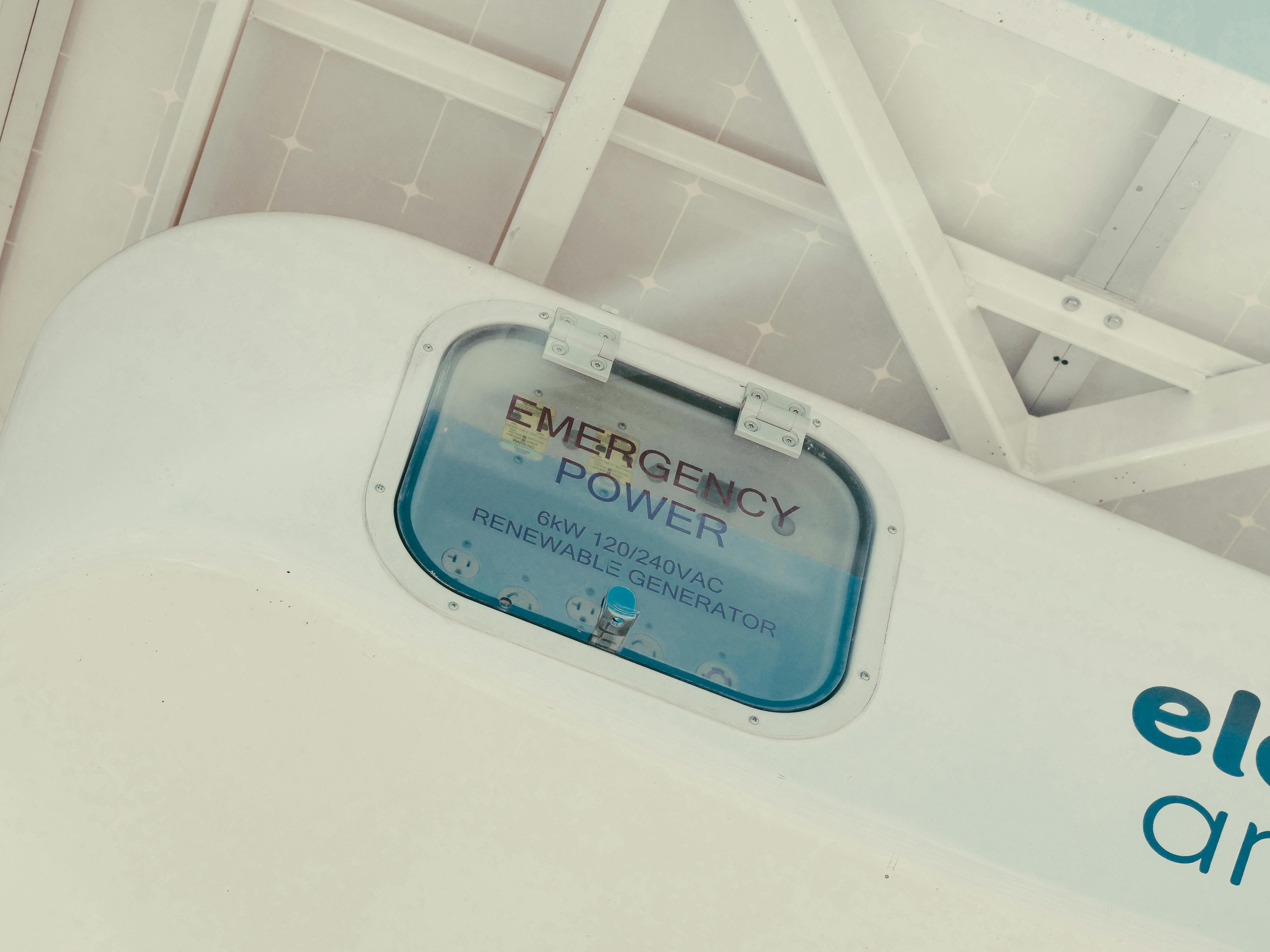 A close up of a white emergency battery power backup box