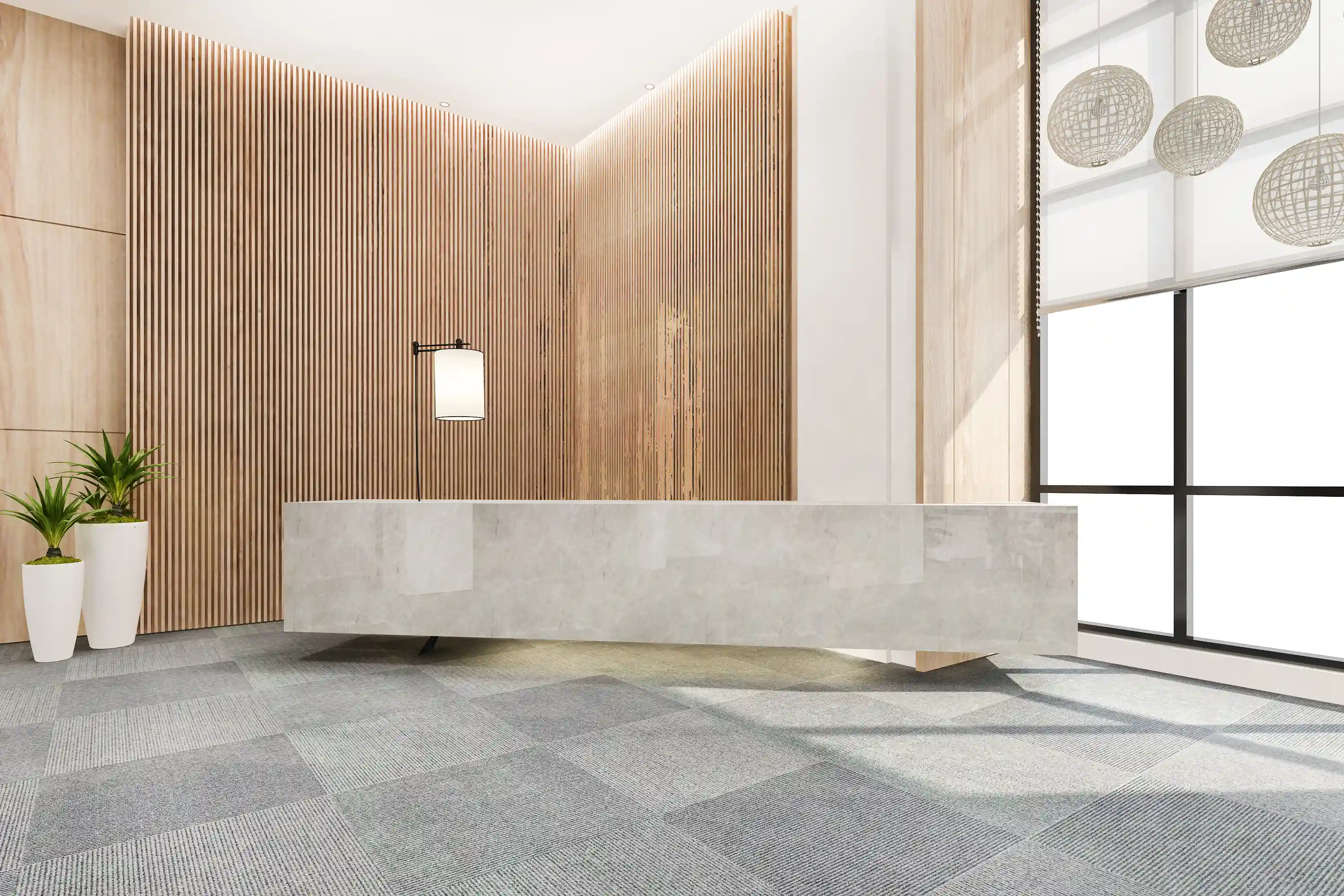 Modern reception area with marble desk, wooden slat walls, and large windows