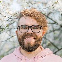 man-with-beard-and-mustache-on-smiling-face-near