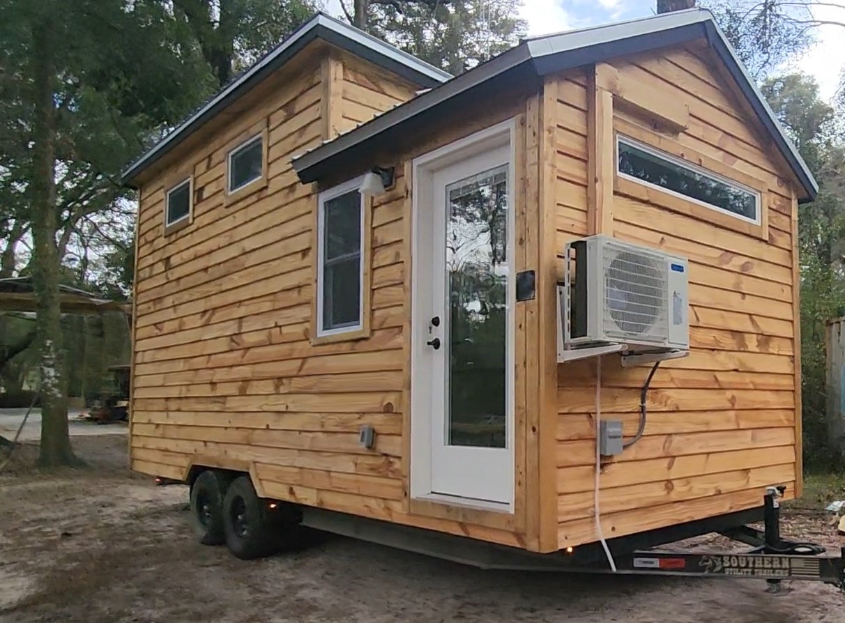 The Alpine tiny home with hybrid A-frame slant roof by Craftsman Tiny Homes