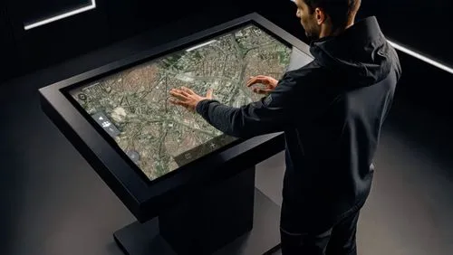 man working with interactive map