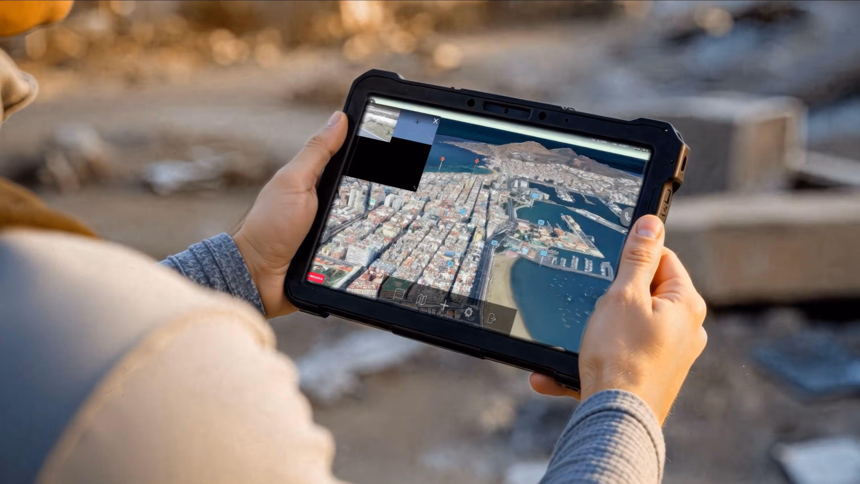 man viewing interactive map in a tablet
