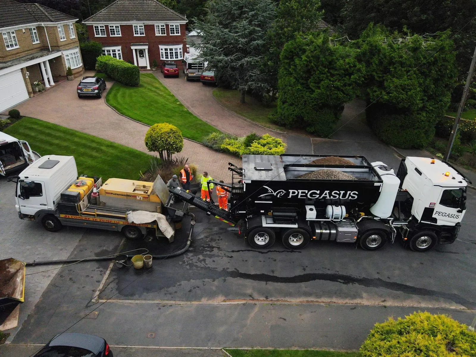 Concrete suppliers mixing and batching on site with lorries