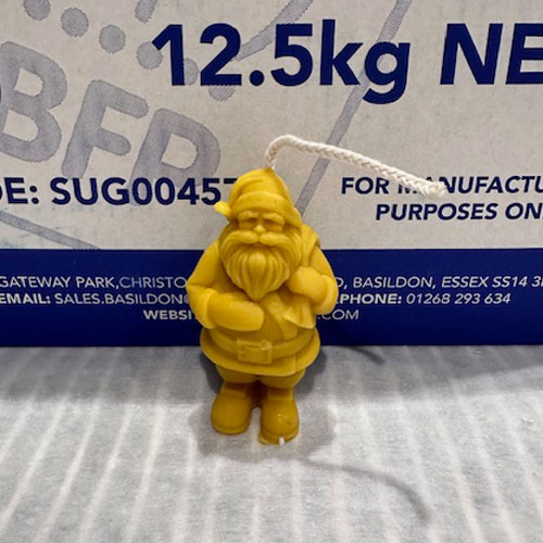 Say ho-ho-honey this Christmas with our Santa Beeswax Candle. He'll bring warmth and the soft scent of natural honey to your home.