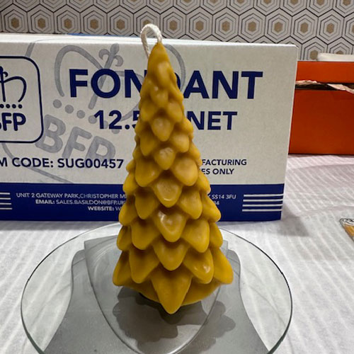 This beautiful beeswax candle is the perfect addition to any festive decorations around the home. Crafted into a classic evergreen tree, it also makes an ideal stocking filler. 