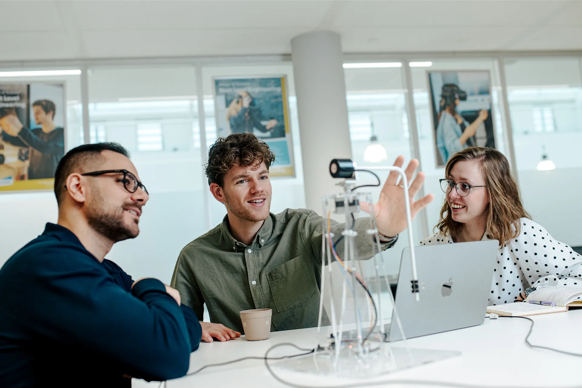 student explains something, gesturing with his hands. 