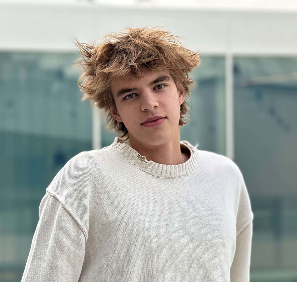 young student looks into the camera. 