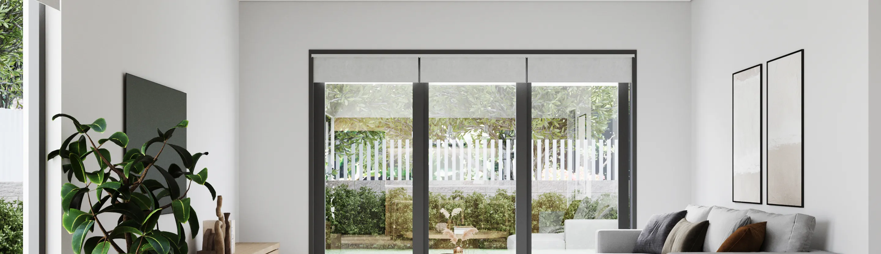 Modern living room with large glass sliding doors opening to a garden, gray sofa with cushions, potted plant, and minimalist wall art.