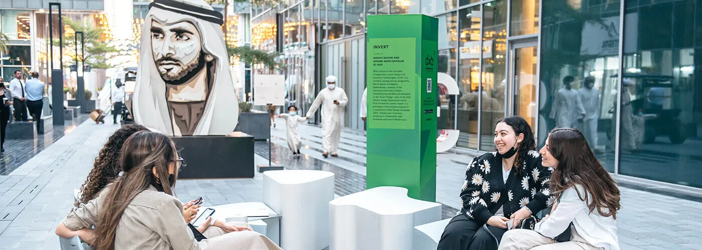 women sitting in D3 district and smiling