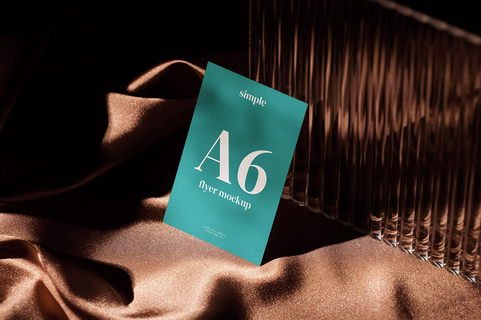 A blue sign sitting on top of a brown cloth.