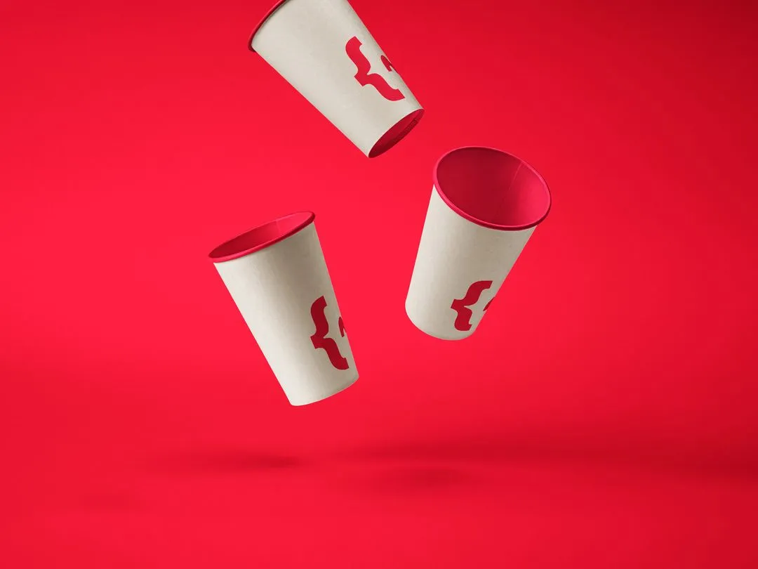 A red and white cup flying through the air