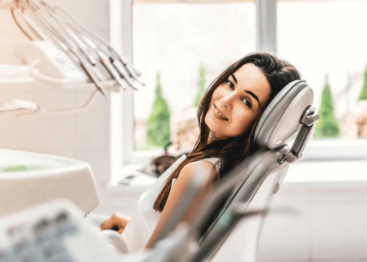An image of a woman looking relaxed undergoing sedation before a dental procedure