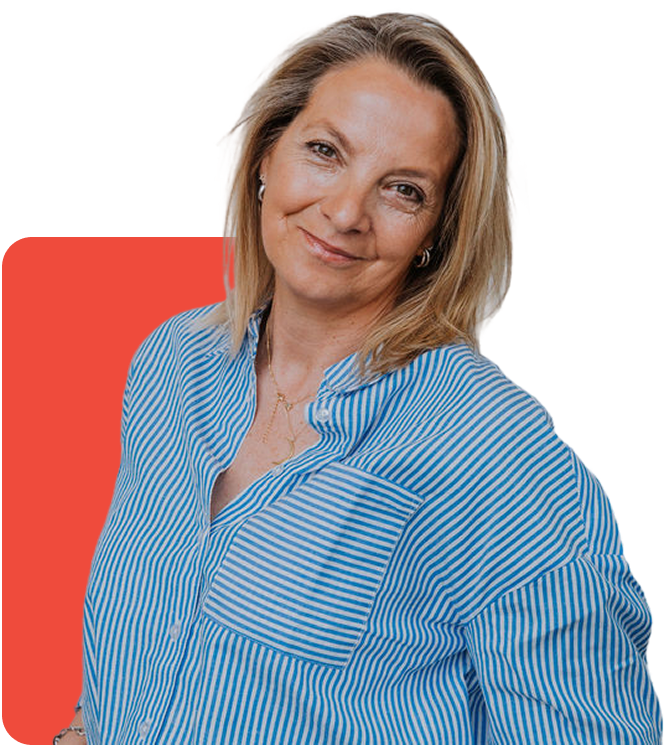 Portrait of a confident professional woman wearing a bold red sweater, standing with arms crossed and smiling against a clean, modern backdrop with blue accent. Ideal for leadership profiles, speaker bios, or company branding showcasing approachability and personal style in business.