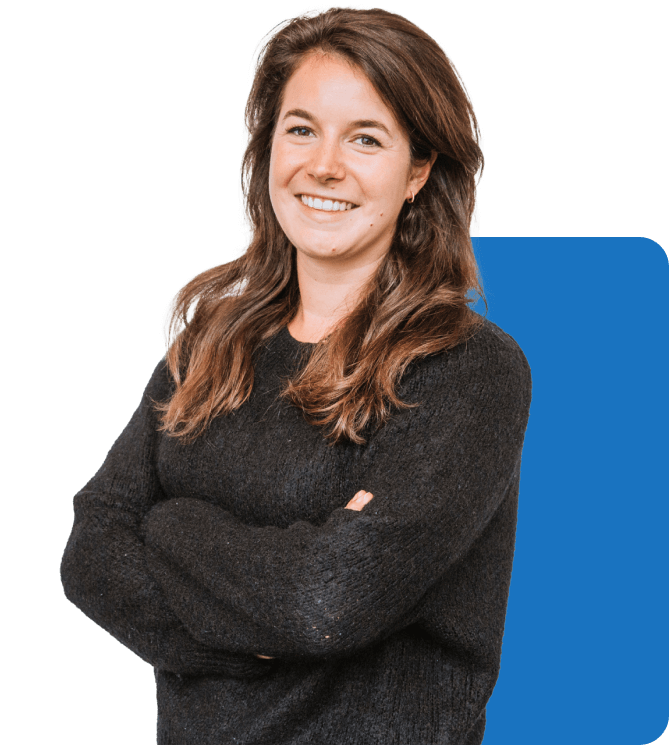 Portrait of a smiling professional woman standing with arms crossed against a clean, geometric background. Her confident posture and friendly expression convey leadership, approachability, and professionalism—ideal for use in corporate bios, team pages, or business branding.