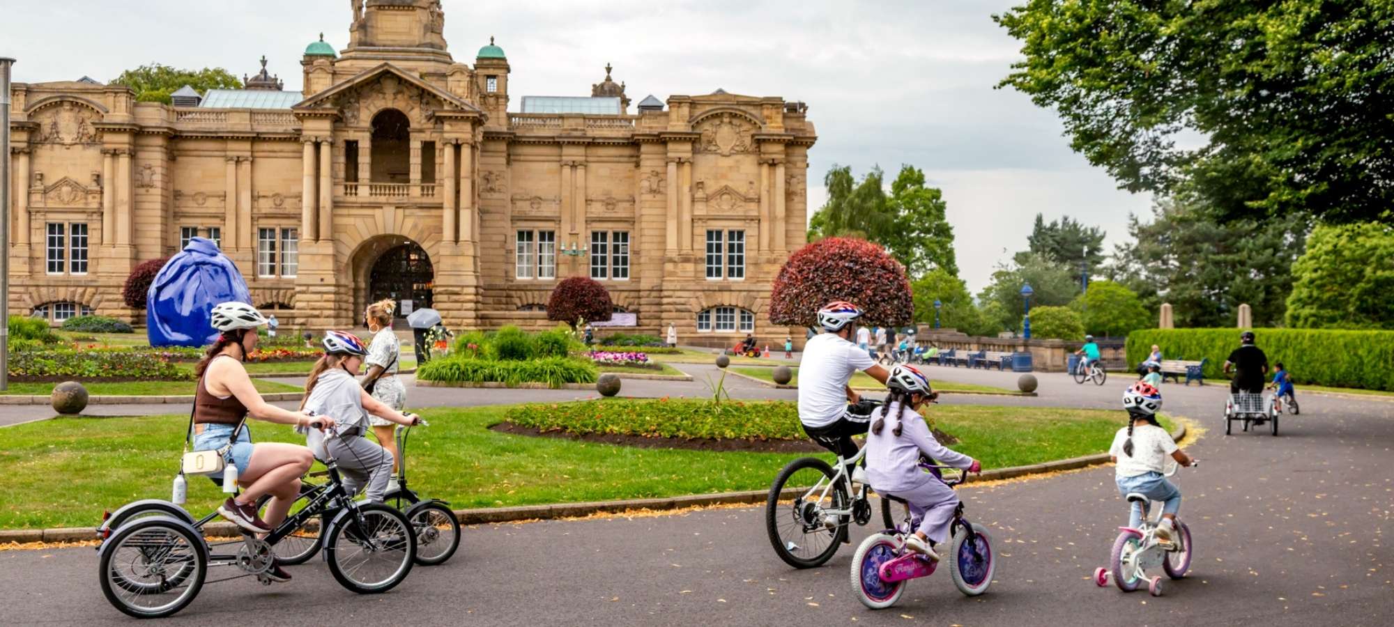 A woman on an electric tricycle in Hillsborough Park