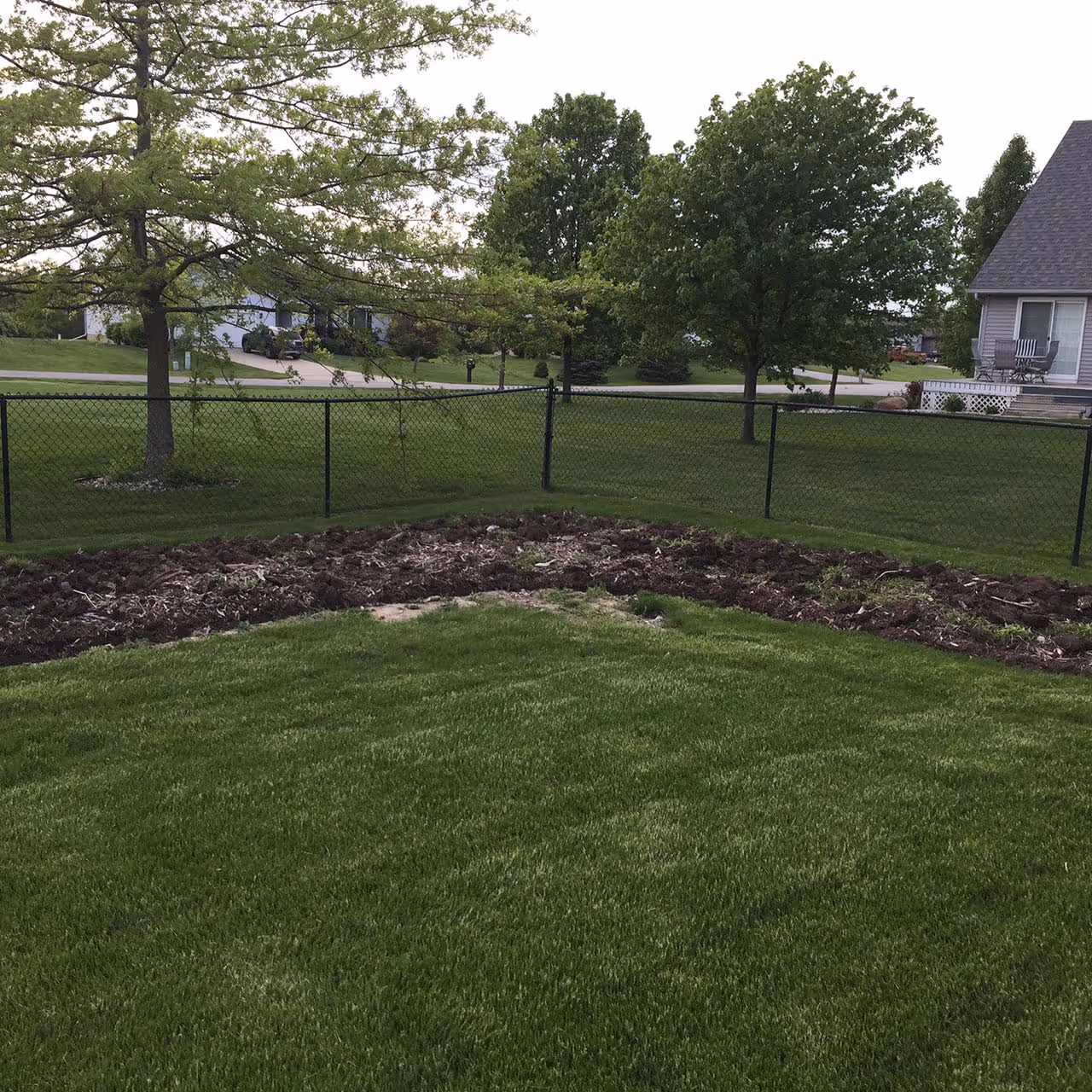 Weeding landscape bed near Adrian MI