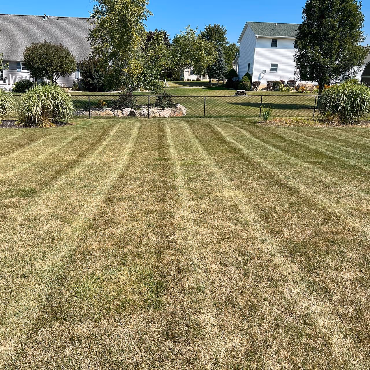 Final yard cleanup after mowing