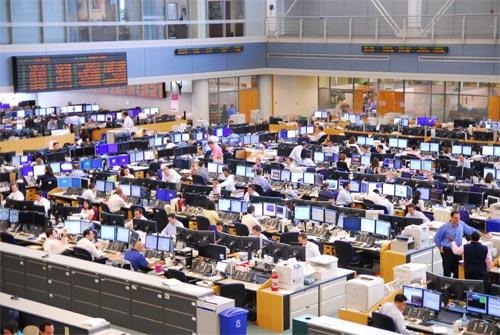 A group of people working at computersAI-generated content may be incorrect.