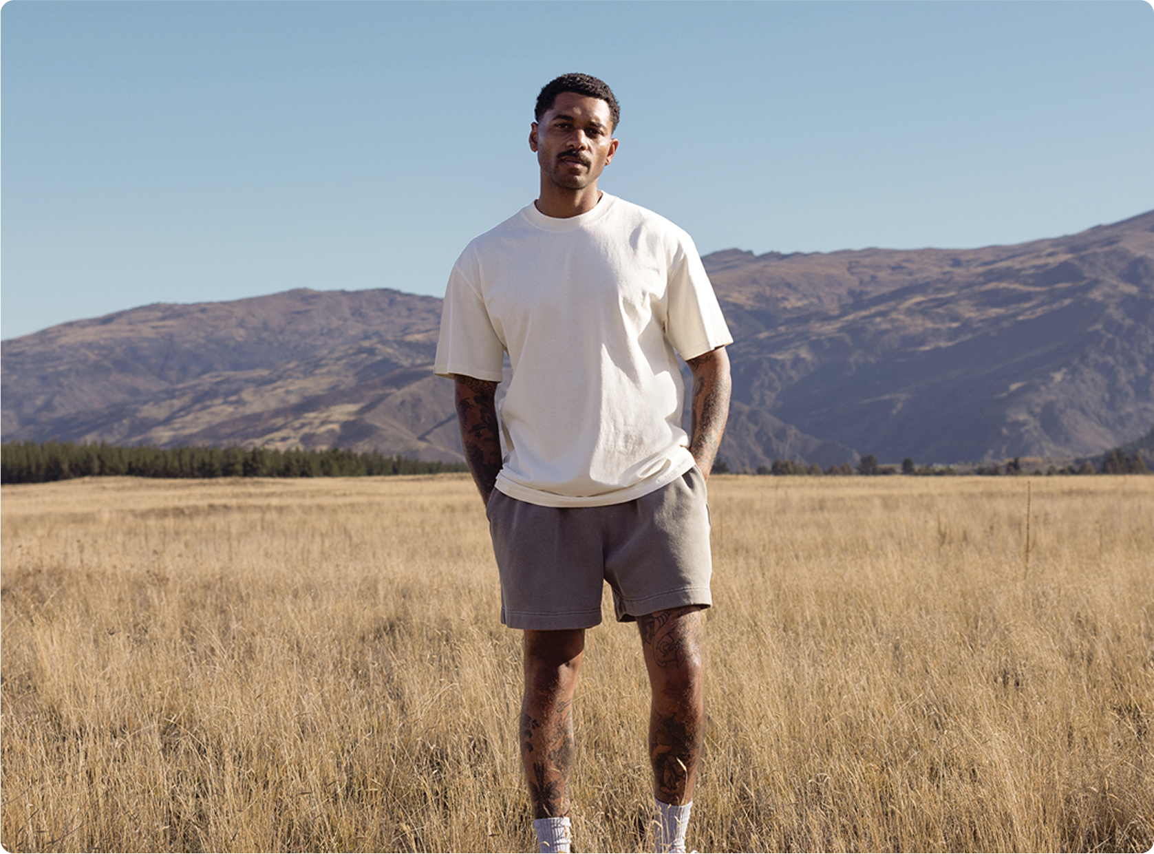 Man wearing on-trend merchandise in nature.